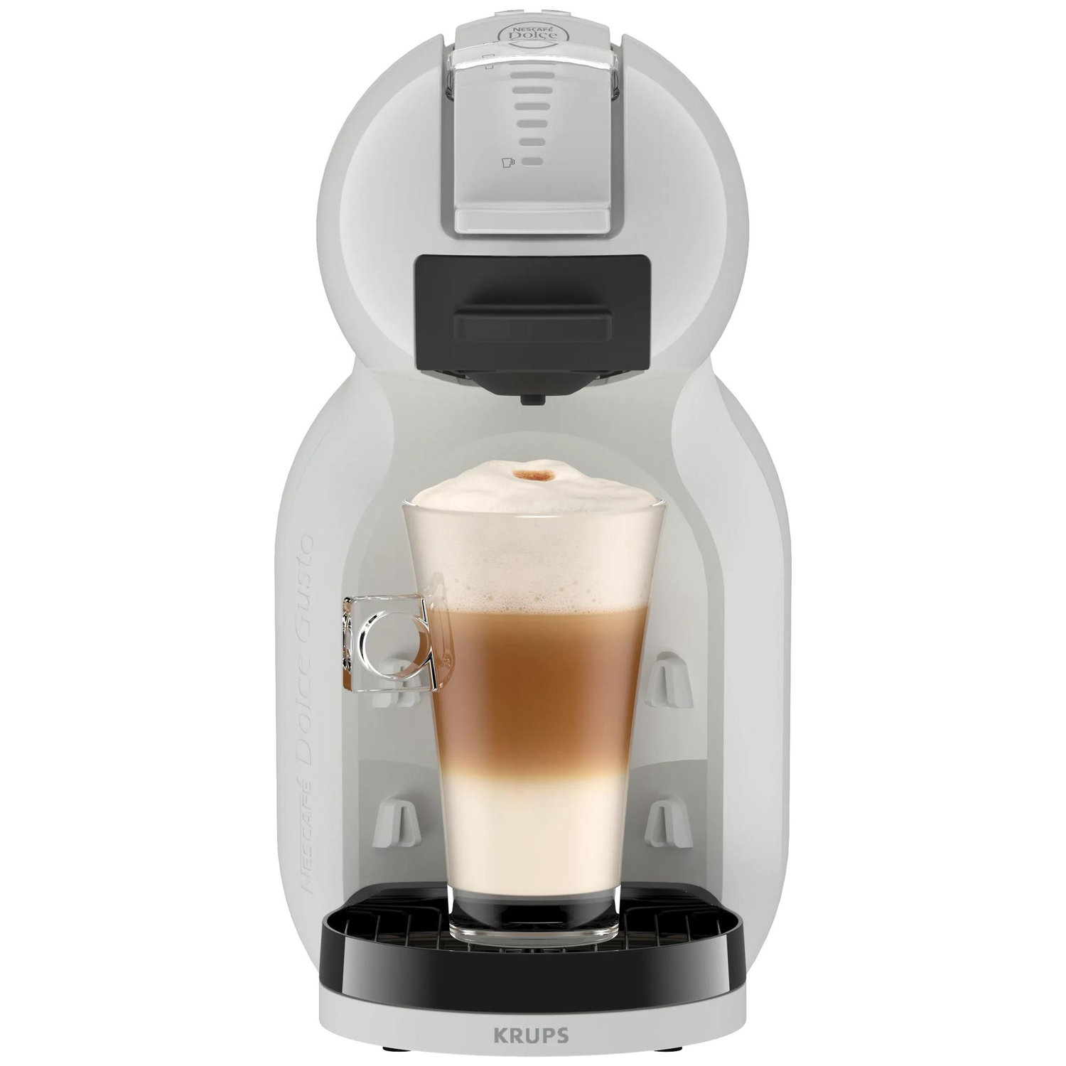 Een witte Nespresso koffiezetapparaat met een glas latte macchiato.