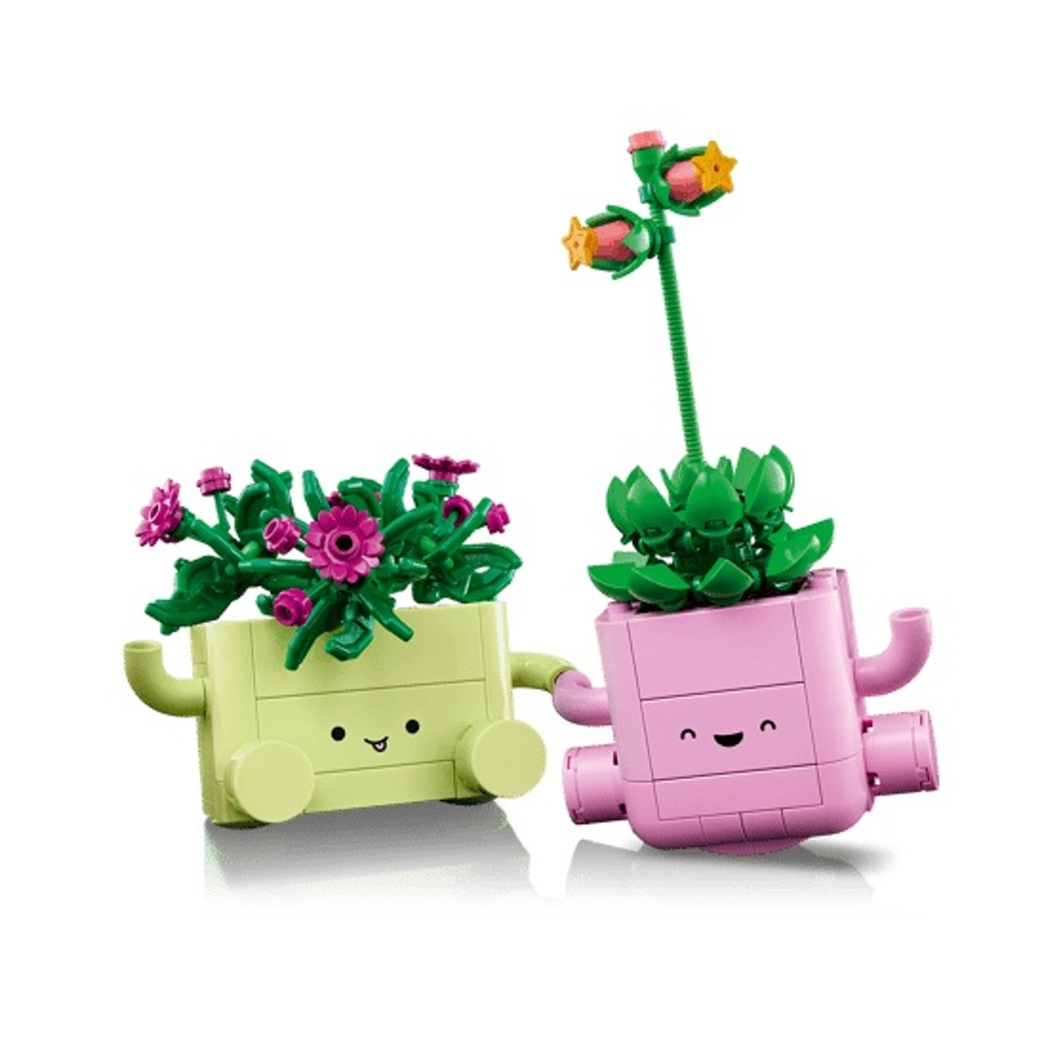 Due fioriere Lego con facce, foglie verdi, una con fiori rosa.