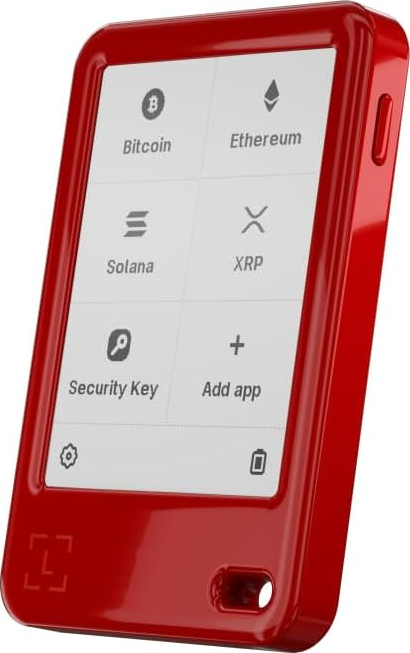 Ein rotes Krypto-Wallet mit einem Bildschirm, der Bitcoin, Ethereum, Solana, XRP anzeigt.