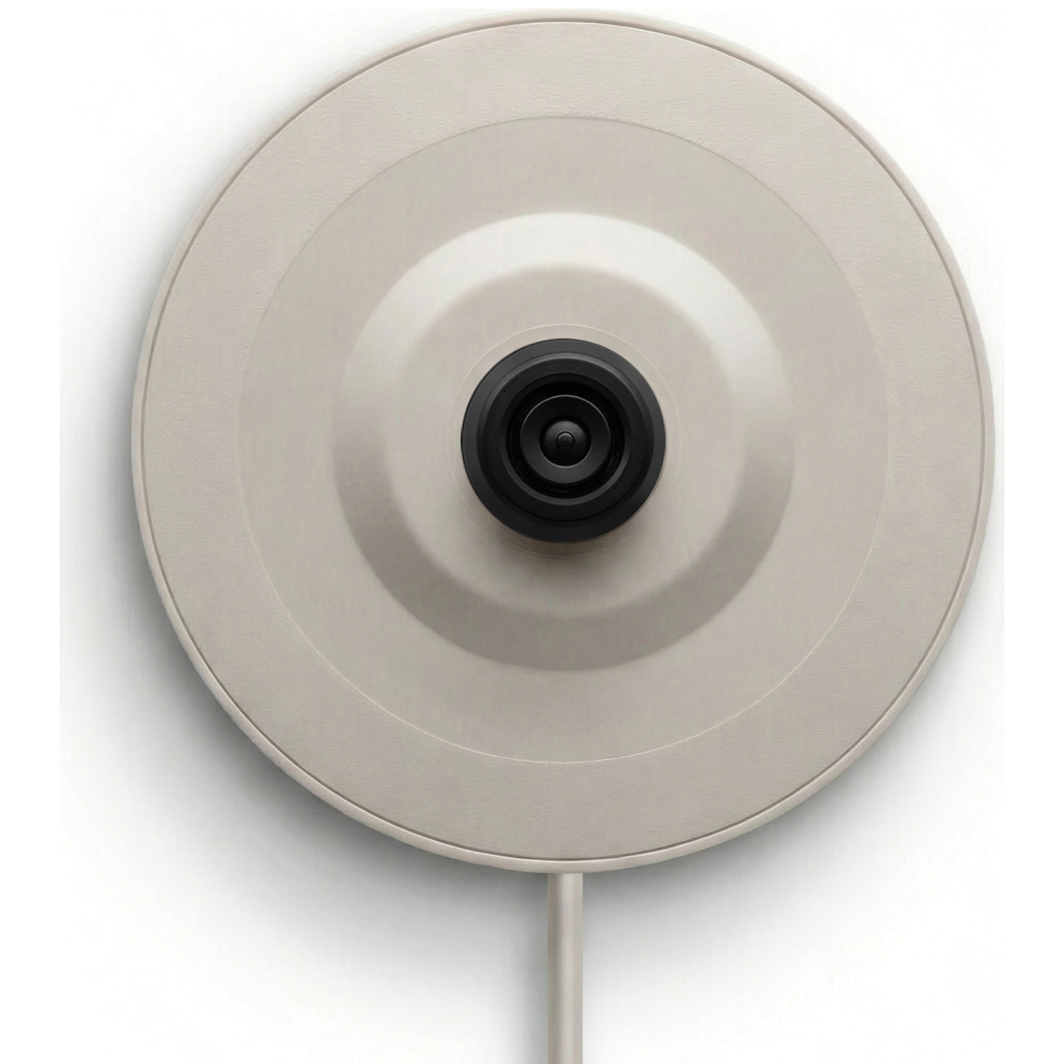 A close-up of the top of a cream-colored electric kettle with a black handle.