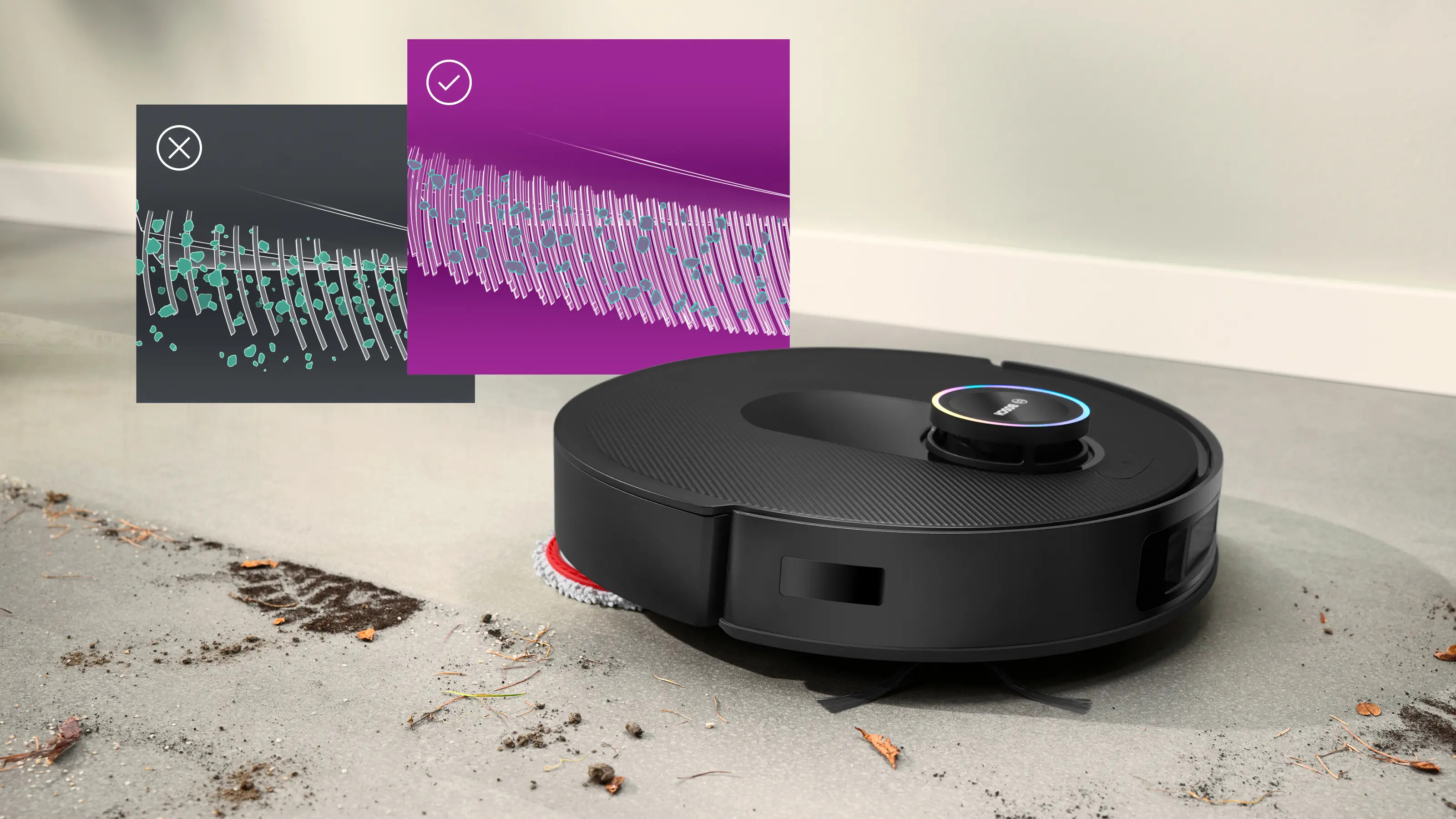 Czarny robot sprzątający czyści brudną podłogę ze śladem buta.