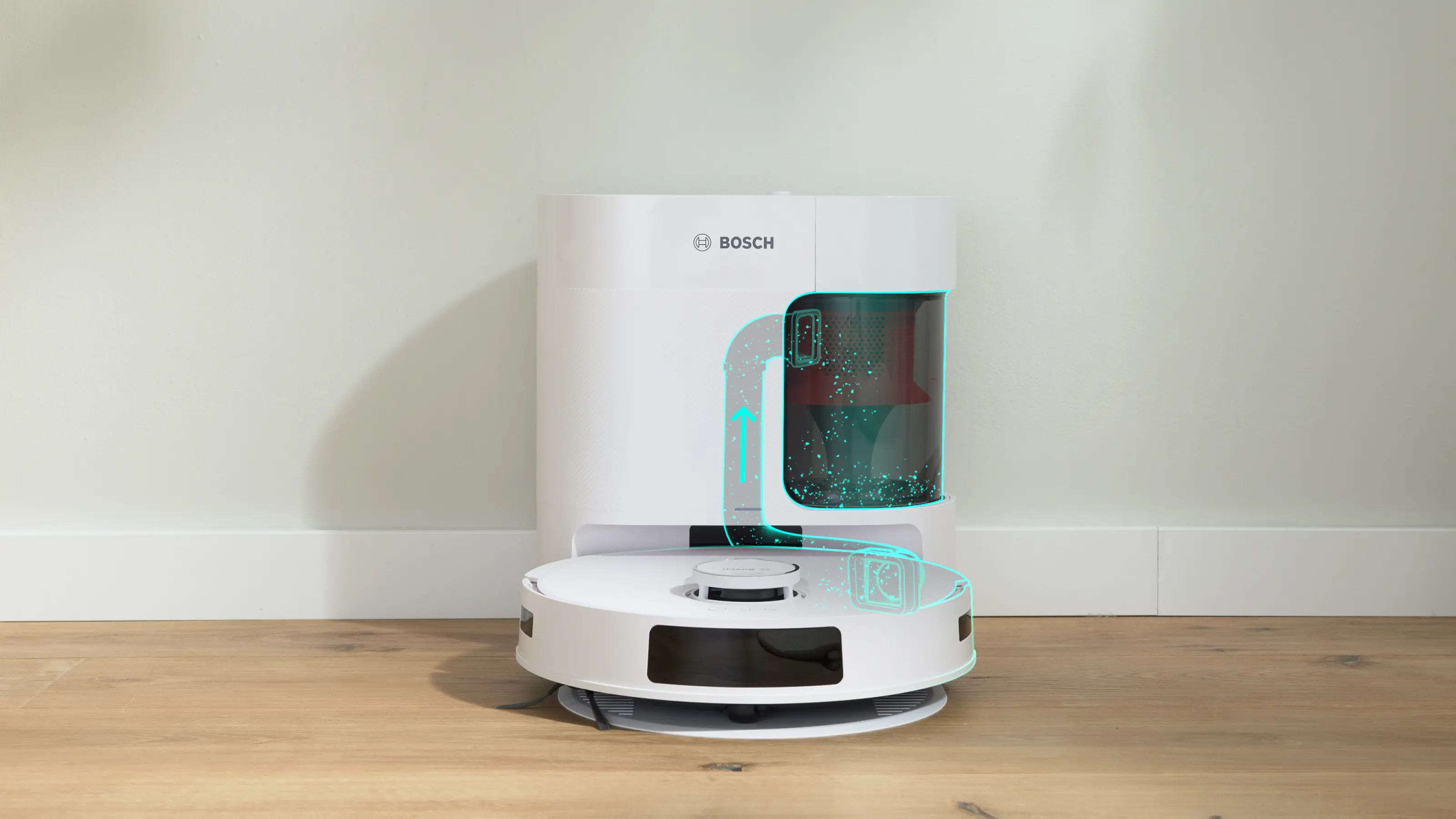 Biały robot sprzątający Bosch ze stacją na drewnianej podłodze przy ścianie.