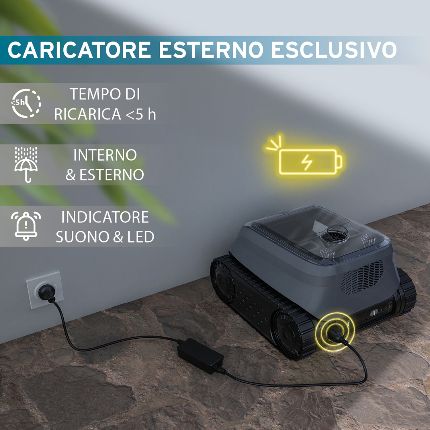 Un robot grigio collegato, con informazioni di ricarica sul muro.