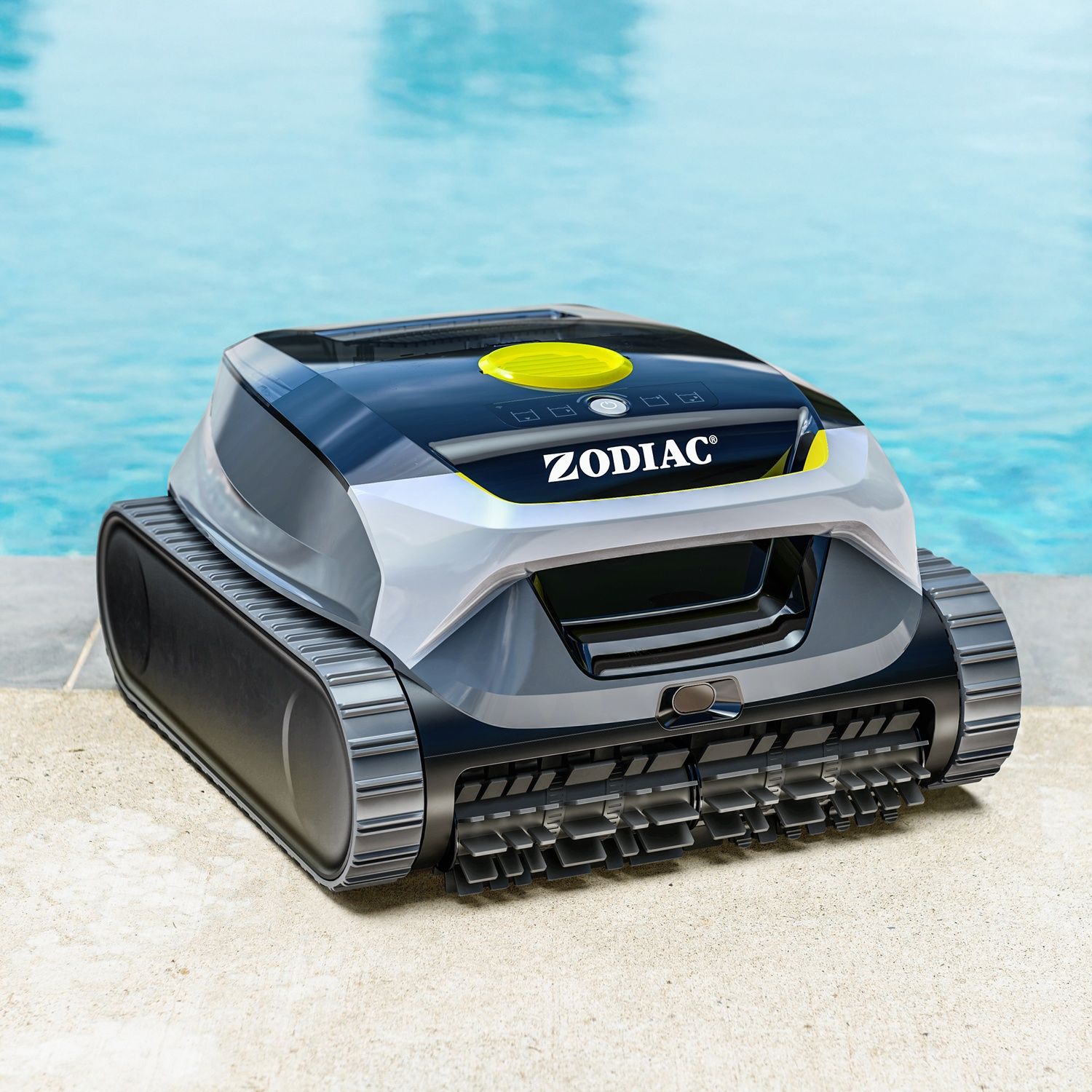 Un pulitore per piscina Zodiac nero e grigio con accenti gialli si trova sul bordo di cemento accanto a una piscina blu.