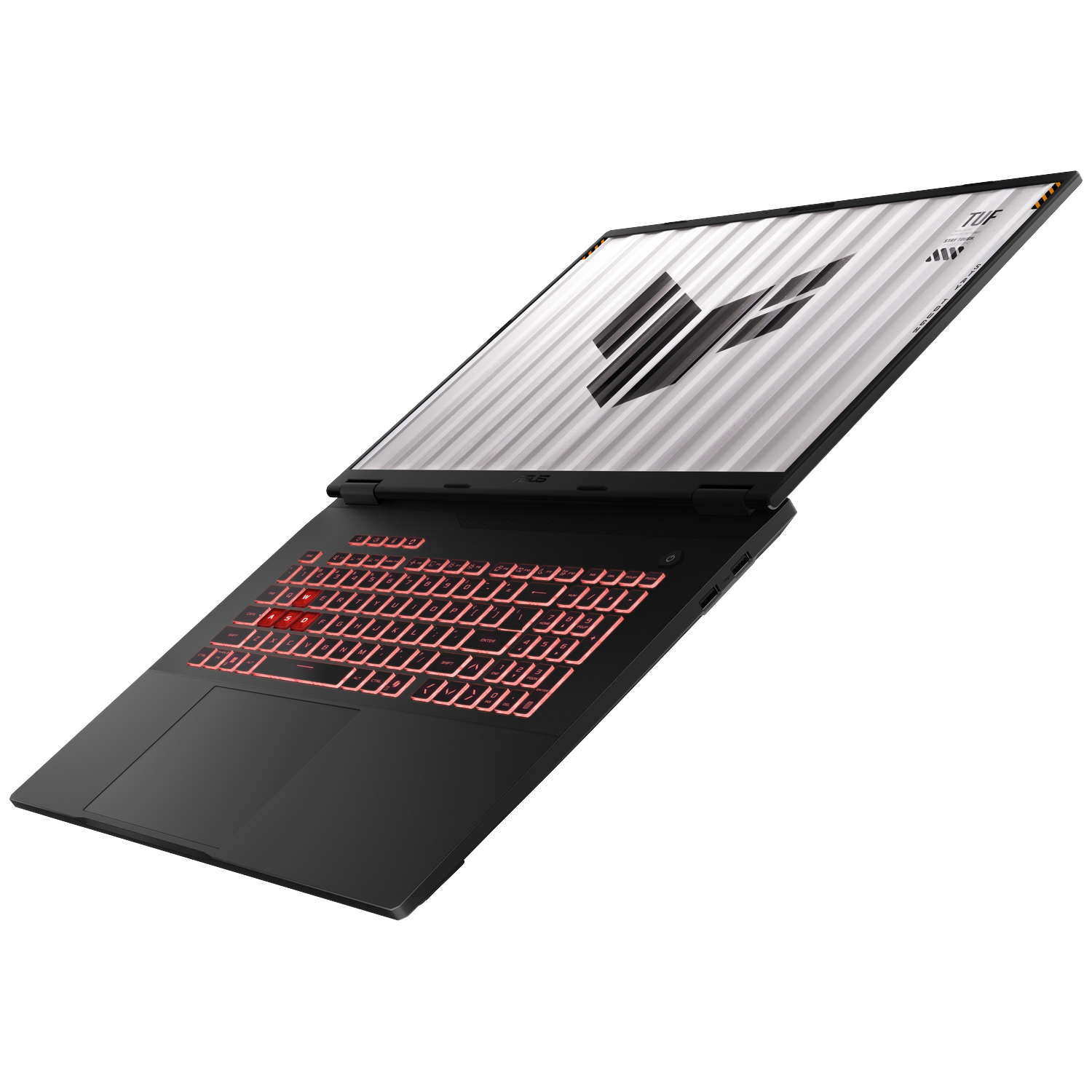 A black laptop with a red backlit keyboard and the TUF logo on the screen.