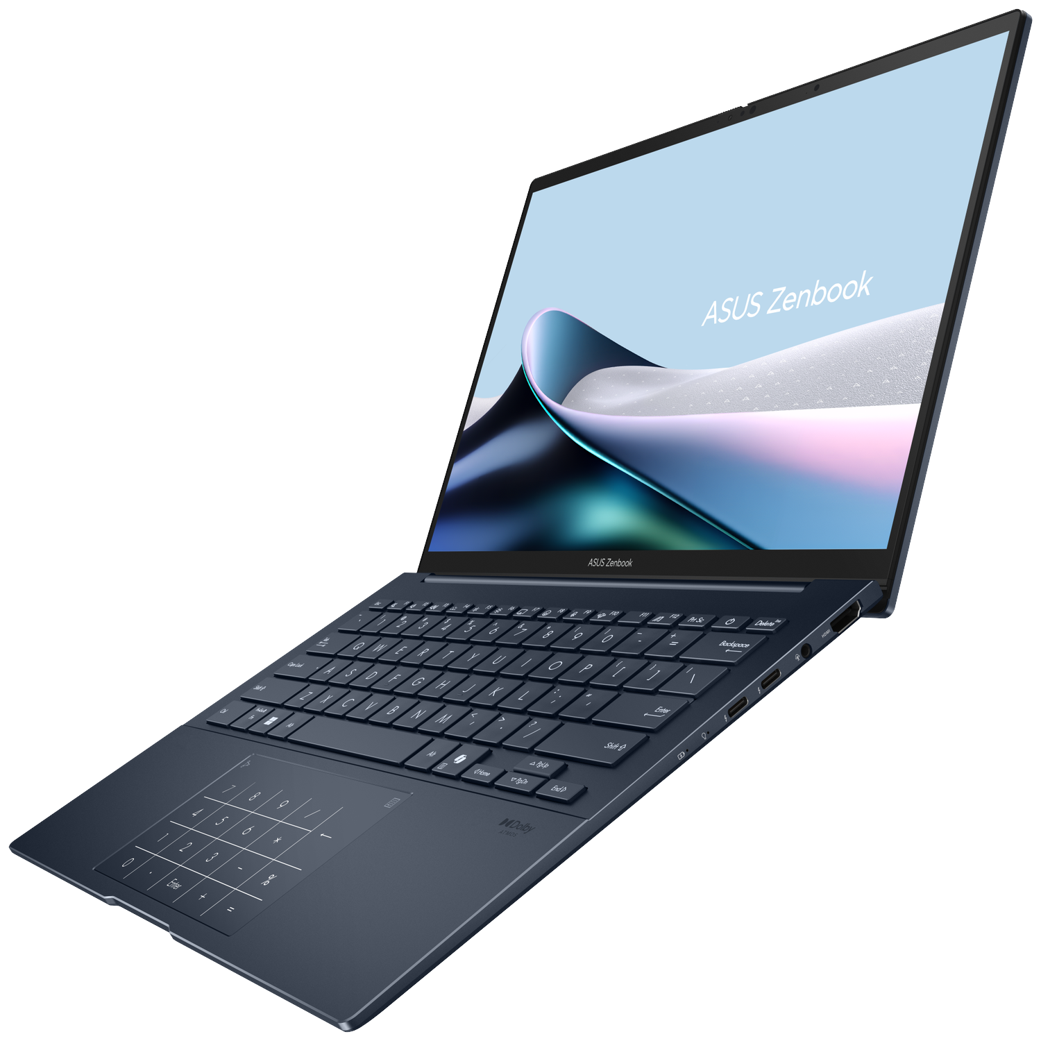 A dark blue Asus Zenbook laptop with a backlit keyboard and number pad.
