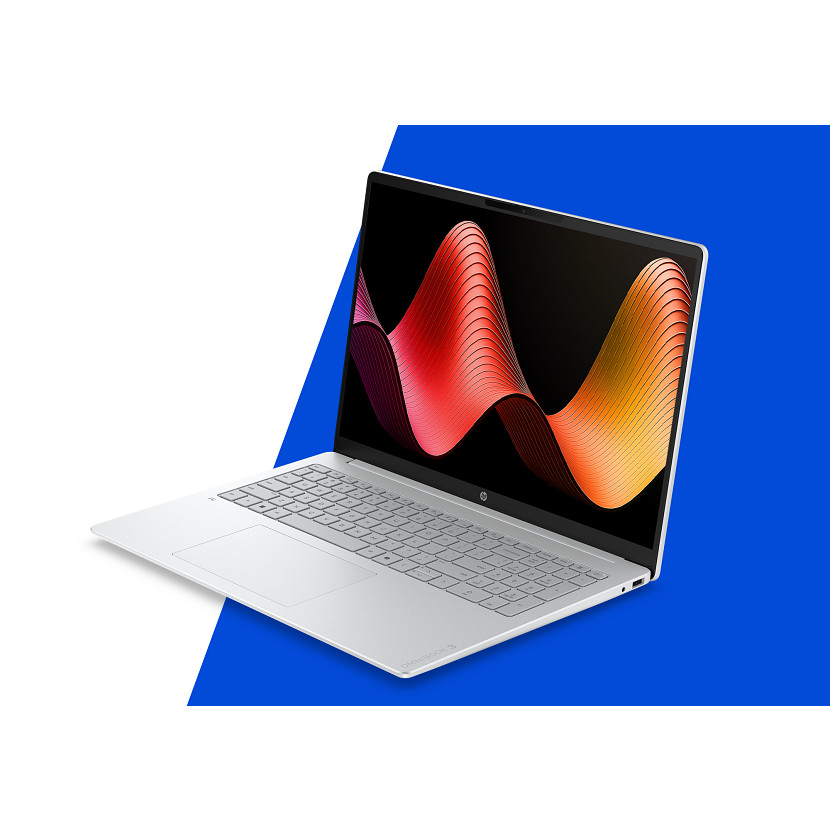 Srebrny laptop wyświetla kolorowy falisty wzór na ekranie.
