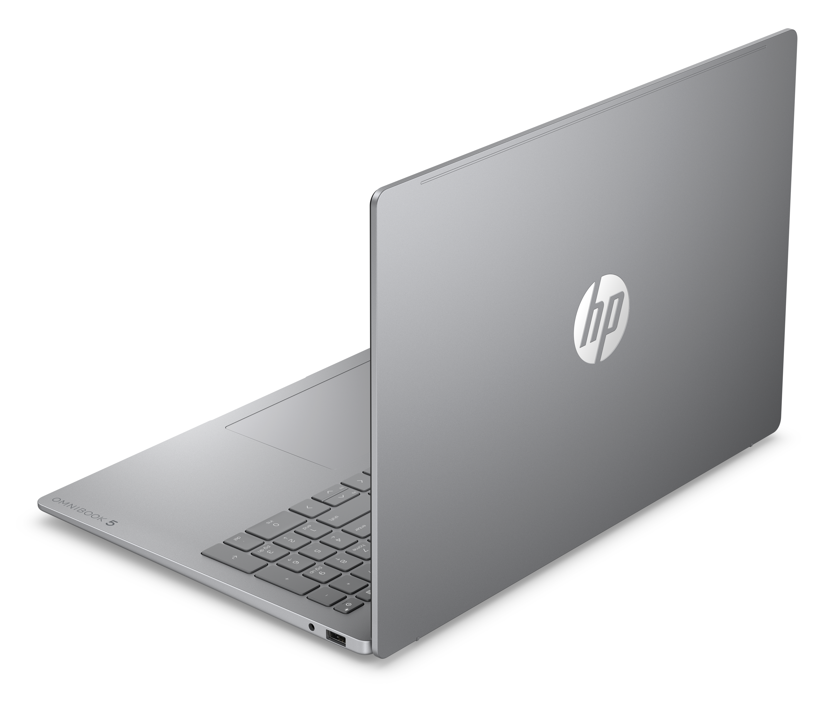 Srebrny laptop HP Omnibook 5 jest otwarty, widać klawiaturę i logo HP.