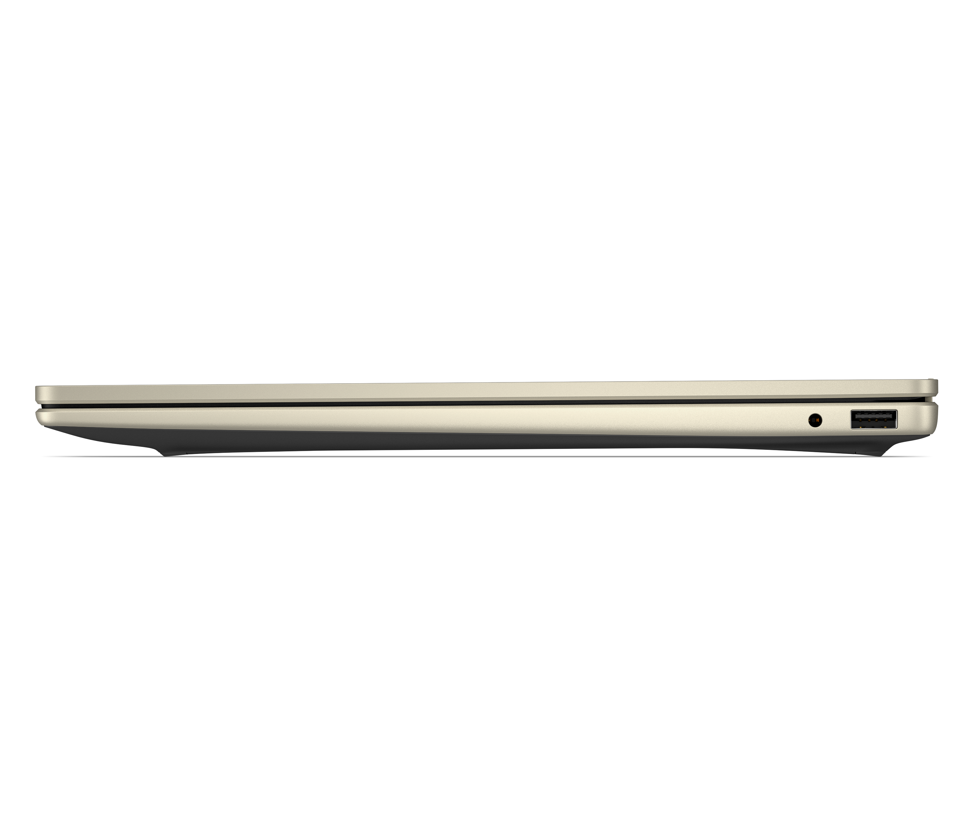 Zamknięty, jasny laptop w profilu na czarnym tle.