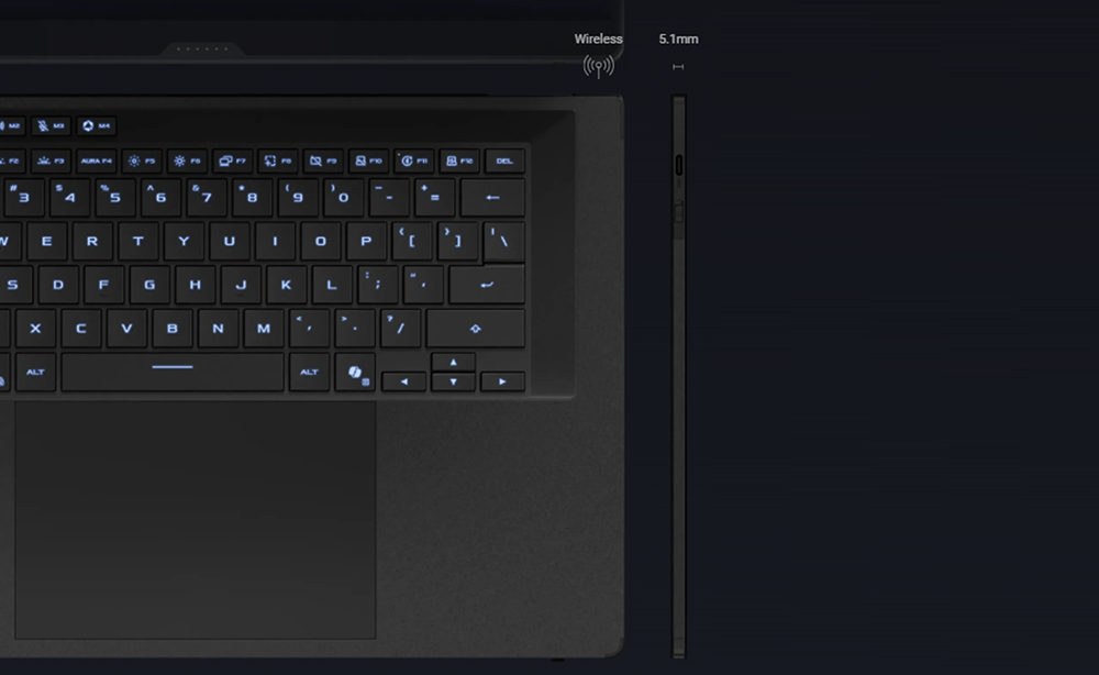 Dunkles Laptop mit beleuchteter Tastatur und Touchpad.