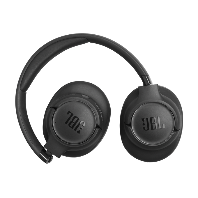 Auriculares JBL negros con diadema y almohadillas sobre fondo negro.