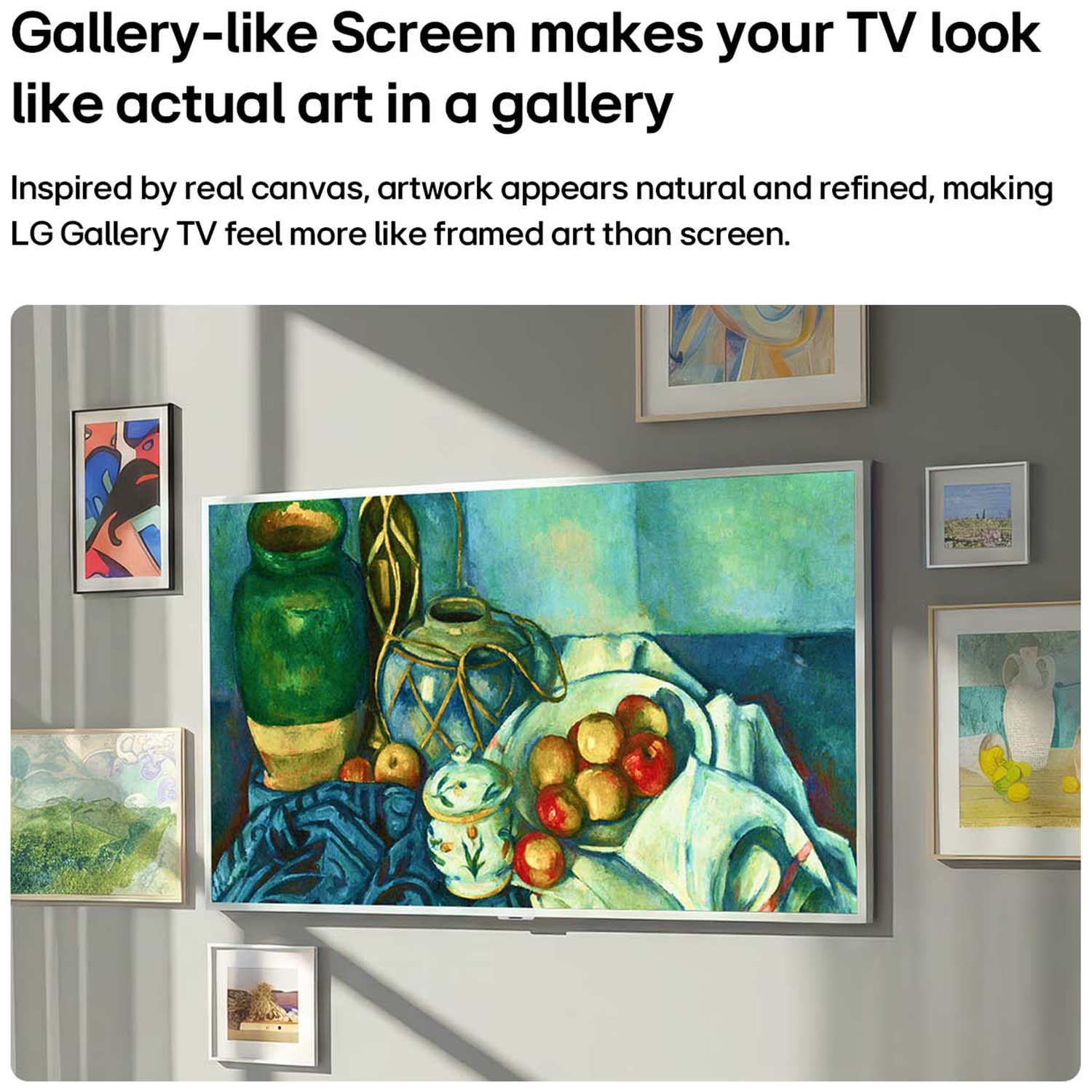 A TV displays a still life painting of fruit and vases, surrounded by other framed art.