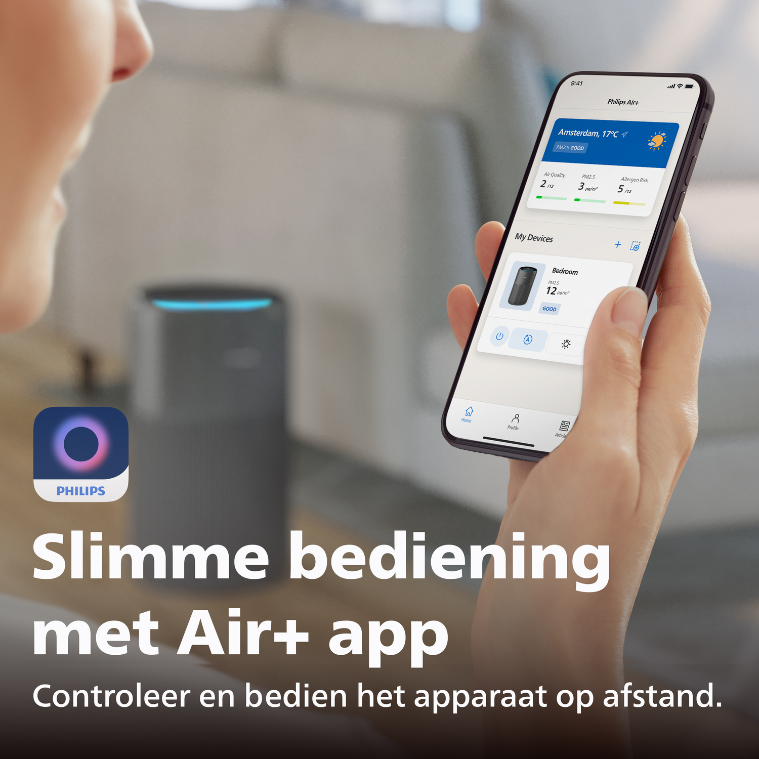 Hand holds smartphone with Philips Air+ app, showing air quality and devices.
