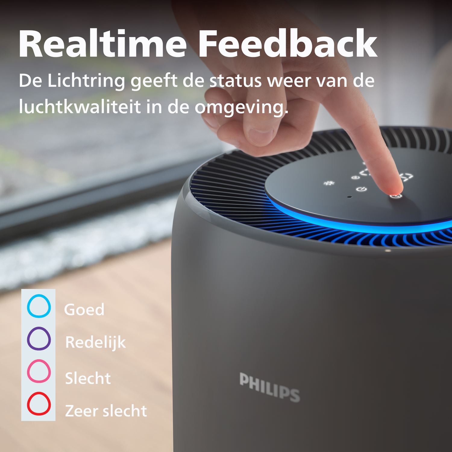 A finger touches the control panel of a Philips air purifier with blue lighting.