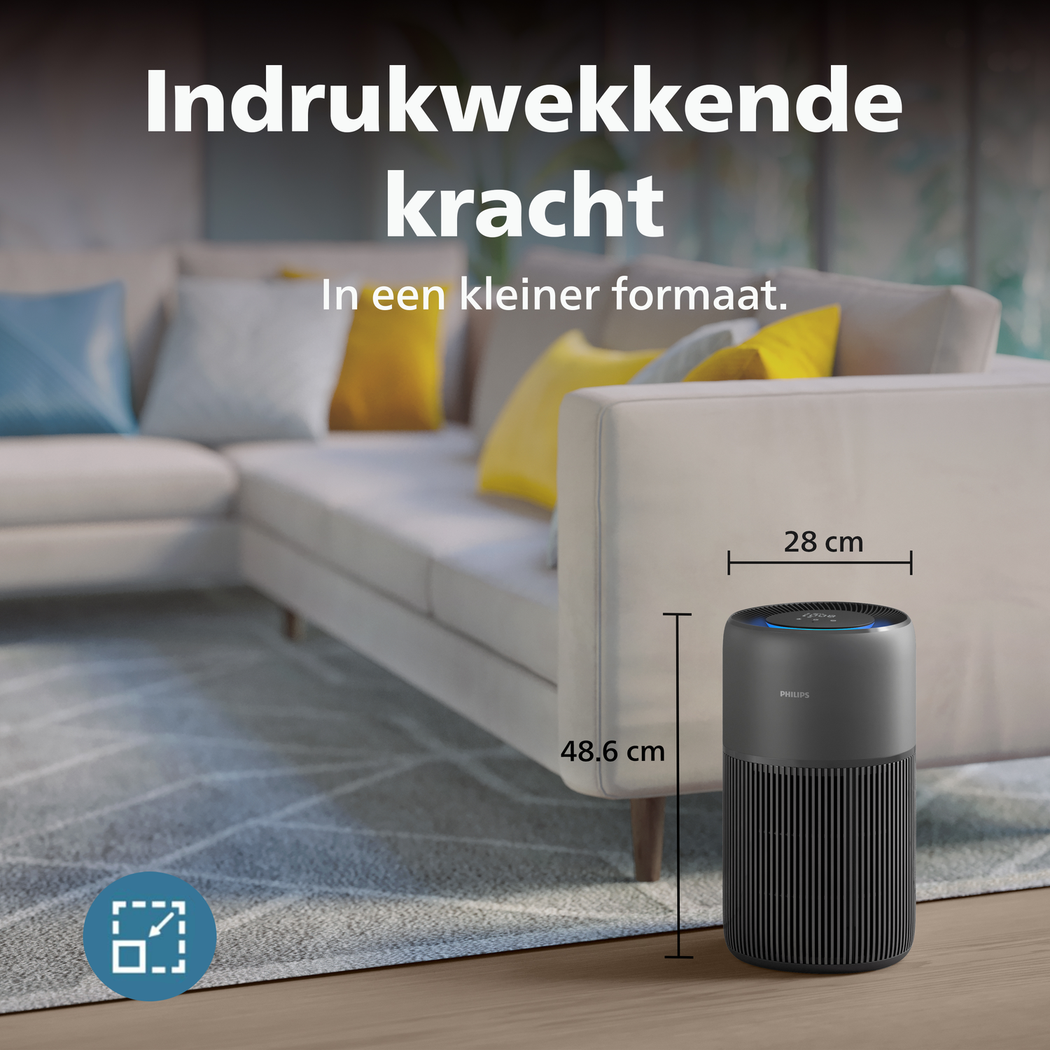 A black Philips air purifier (48.6 x 28 cm) stands next to a sofa with cushions.