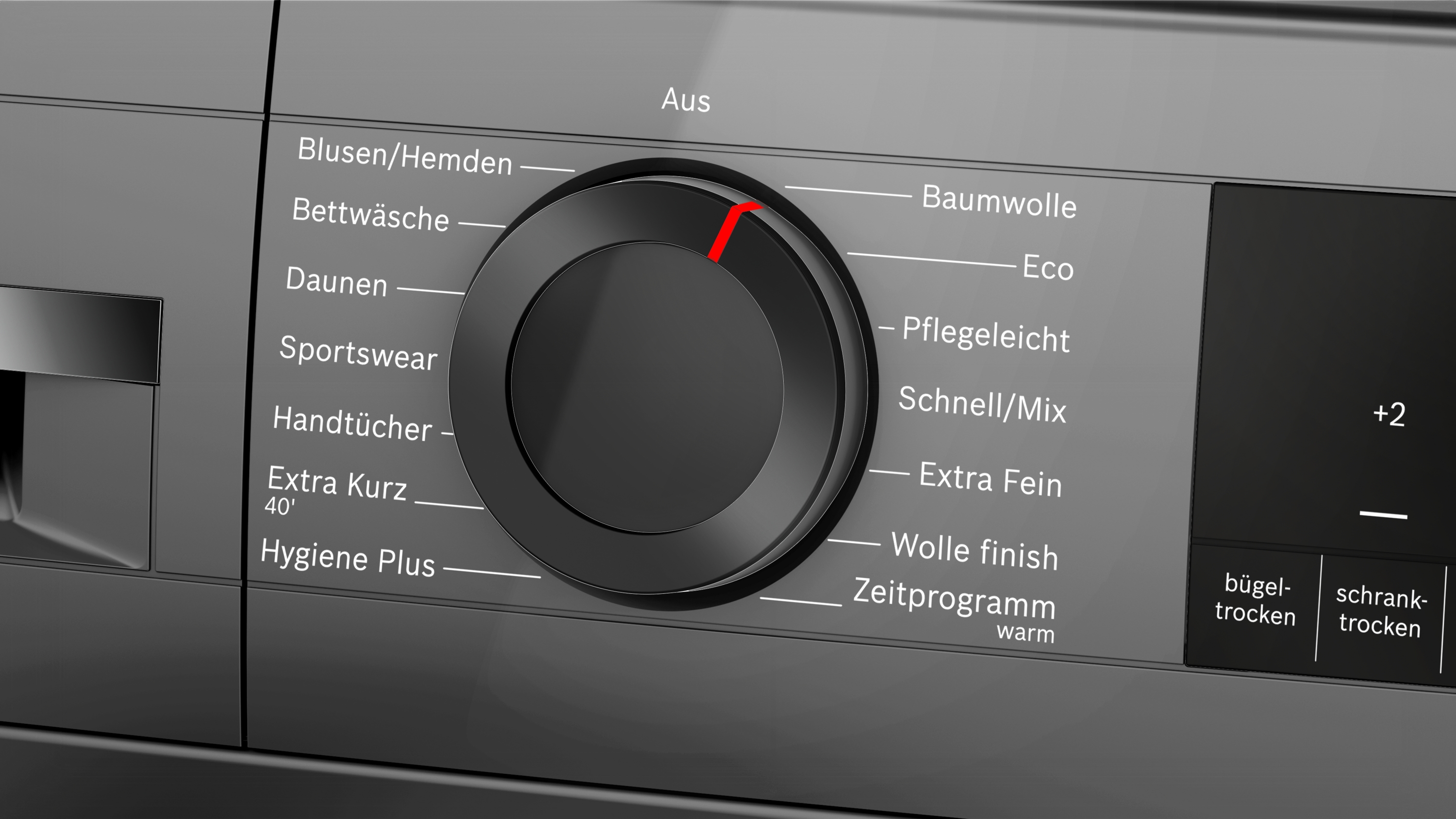 Ein moderner Wäschetrockner mit Drehknopf und Display. Programme wie Baumwolle, Eco, Pflegeleicht sind wählbar.