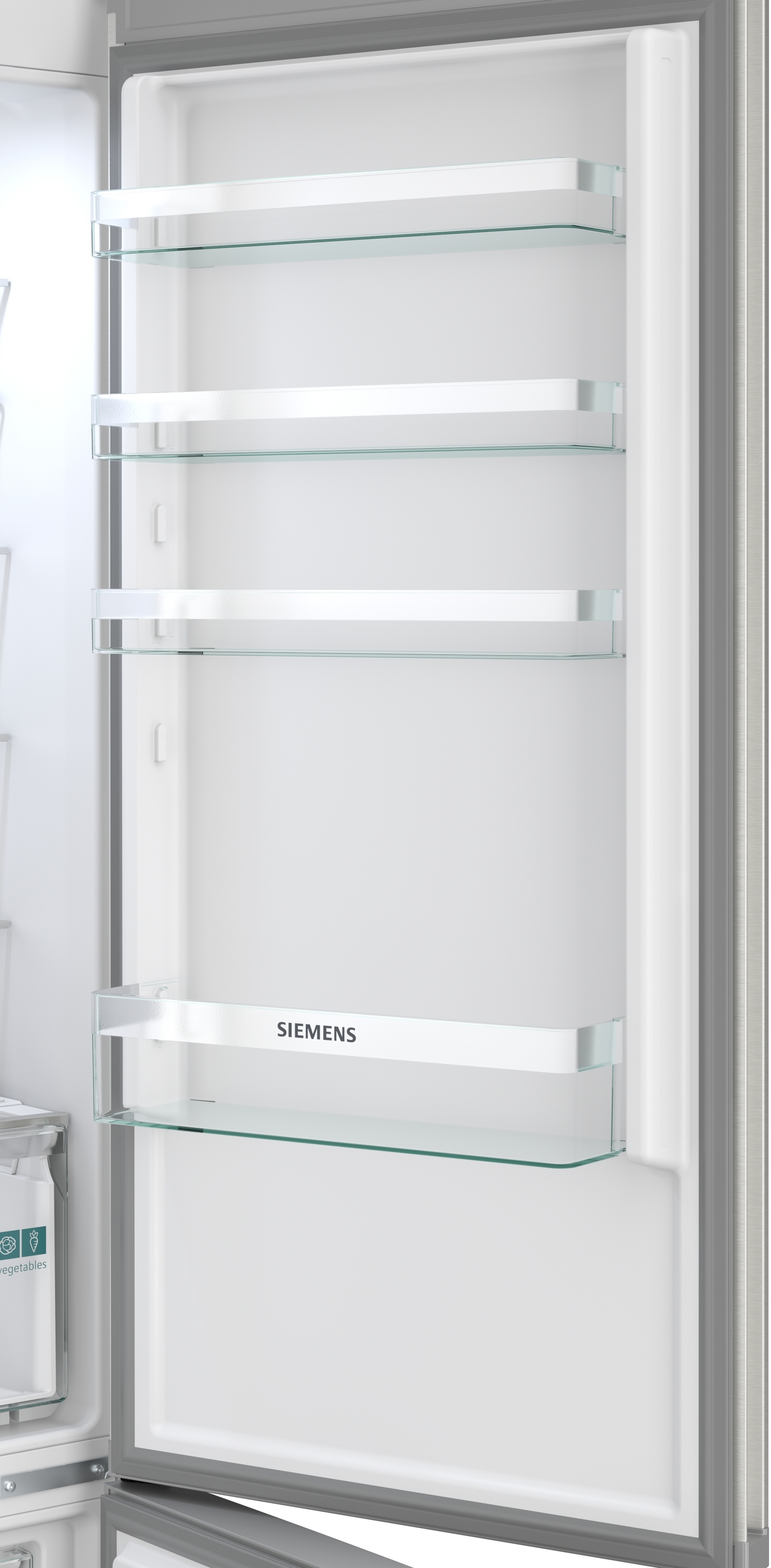 Ein leerer Siemens Kühlschrank mit Glasböden und einer Gemüseschublade.