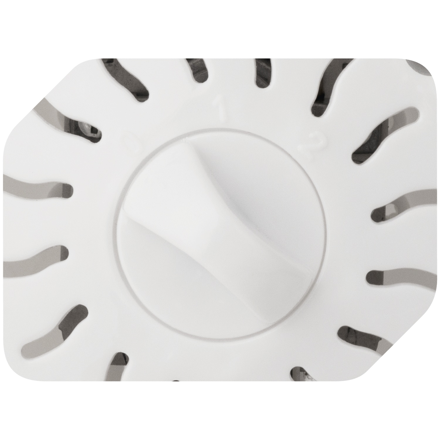 A white, round plastic cover with slots and a central knob.