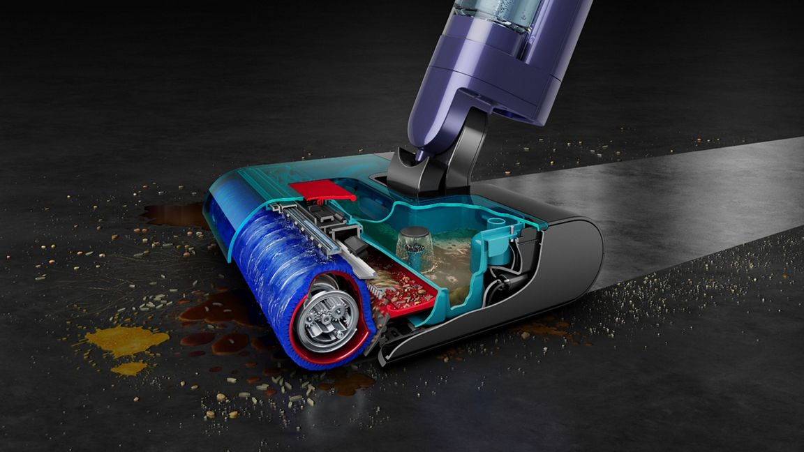 Vue en coupe d'un aspirateur avec une tête de brosse bleue aspirant des débris.