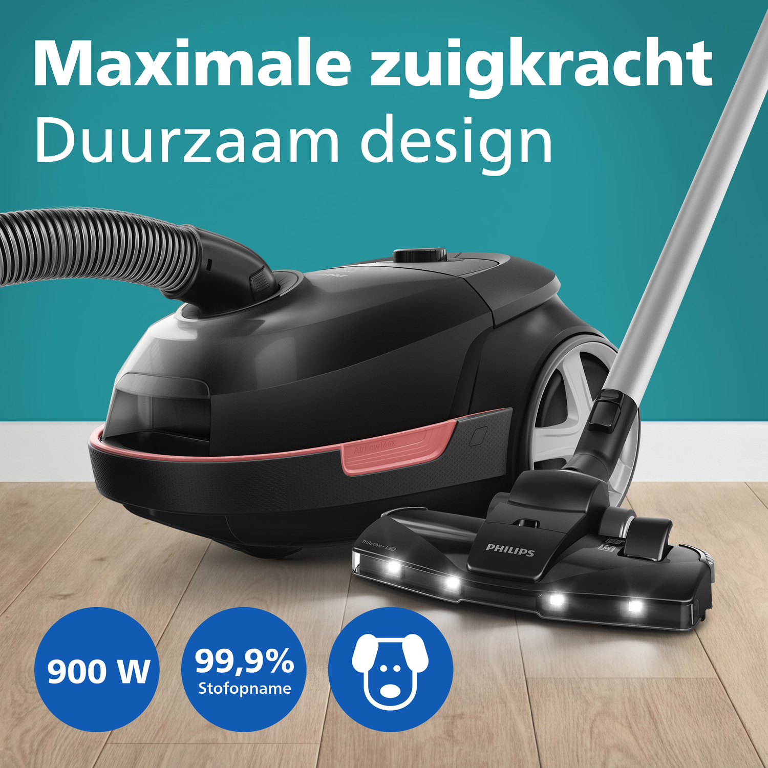Zwarte Philips stofzuiger met slang en borstel op houten vloer. Iconen 900W, 99,9% stofopname, hond.
