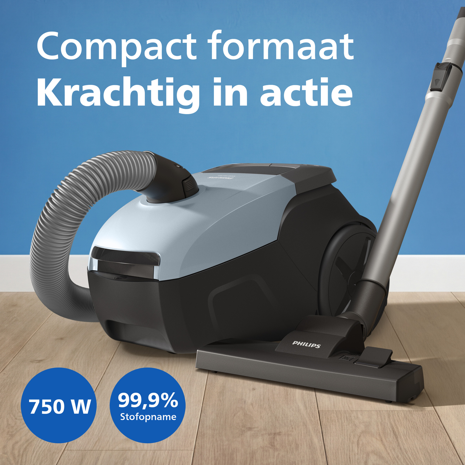 A Philips vacuum cleaner with 750W and 99.9% dust pick-up on a wooden floor.