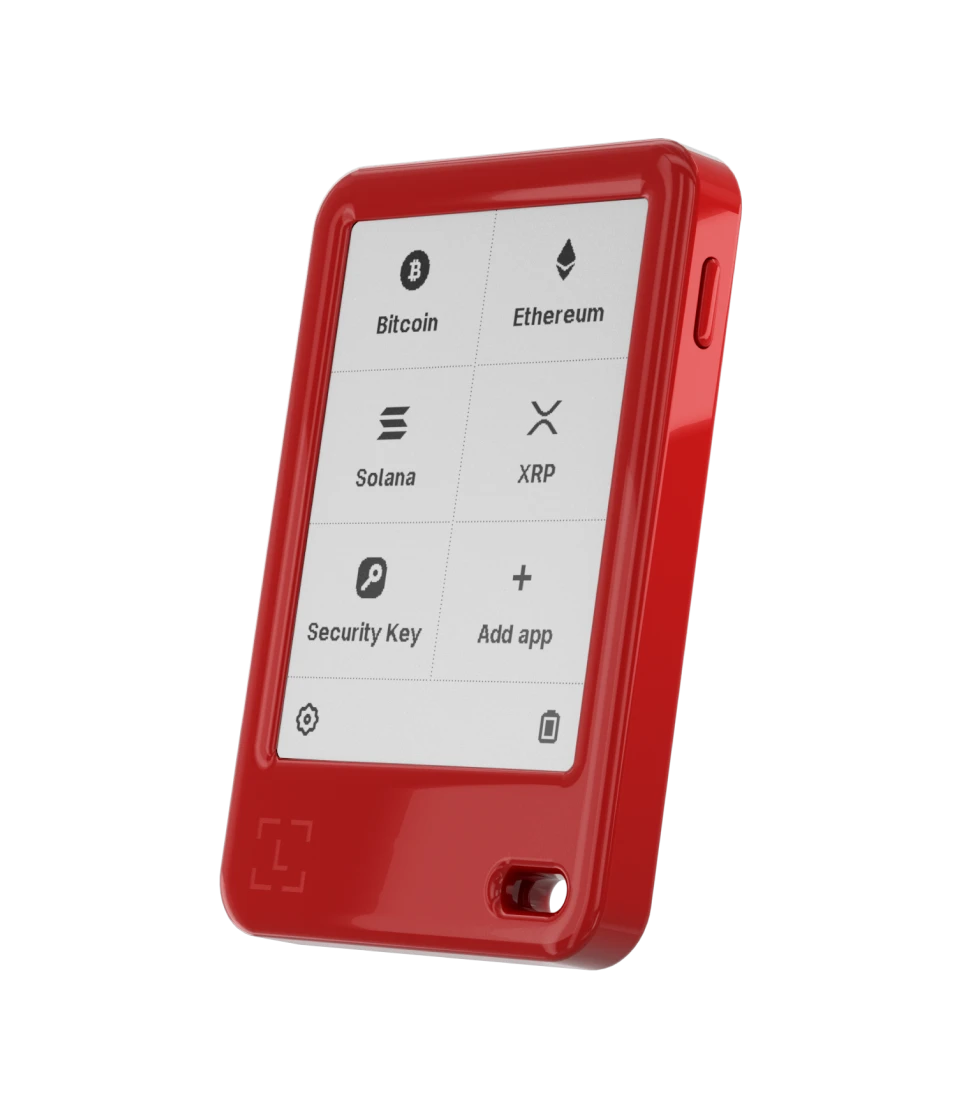 Ein rotes Krypto-Hardware-Wallet mit einem Touchscreen, der Bitcoin, Ethereum, Solana und XRP anzeigt.