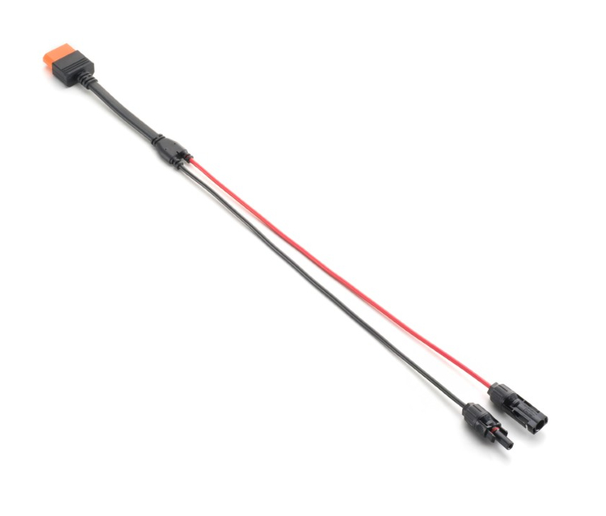 Pomarańczowy złącznik z czarnym kablem rozdzielającym się na czerwony i czarny przewód.