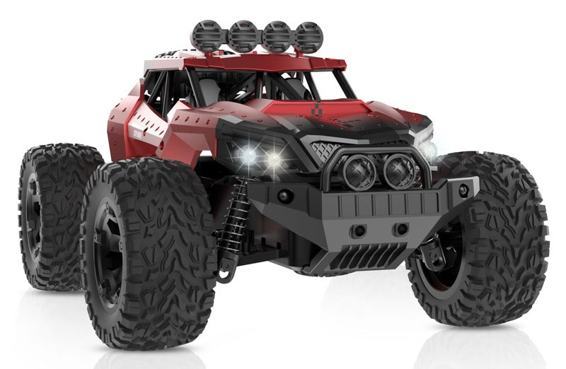 Czerwony pojazd terenowy zdalnie sterowany z dużymi oponami i czterema reflektorami.