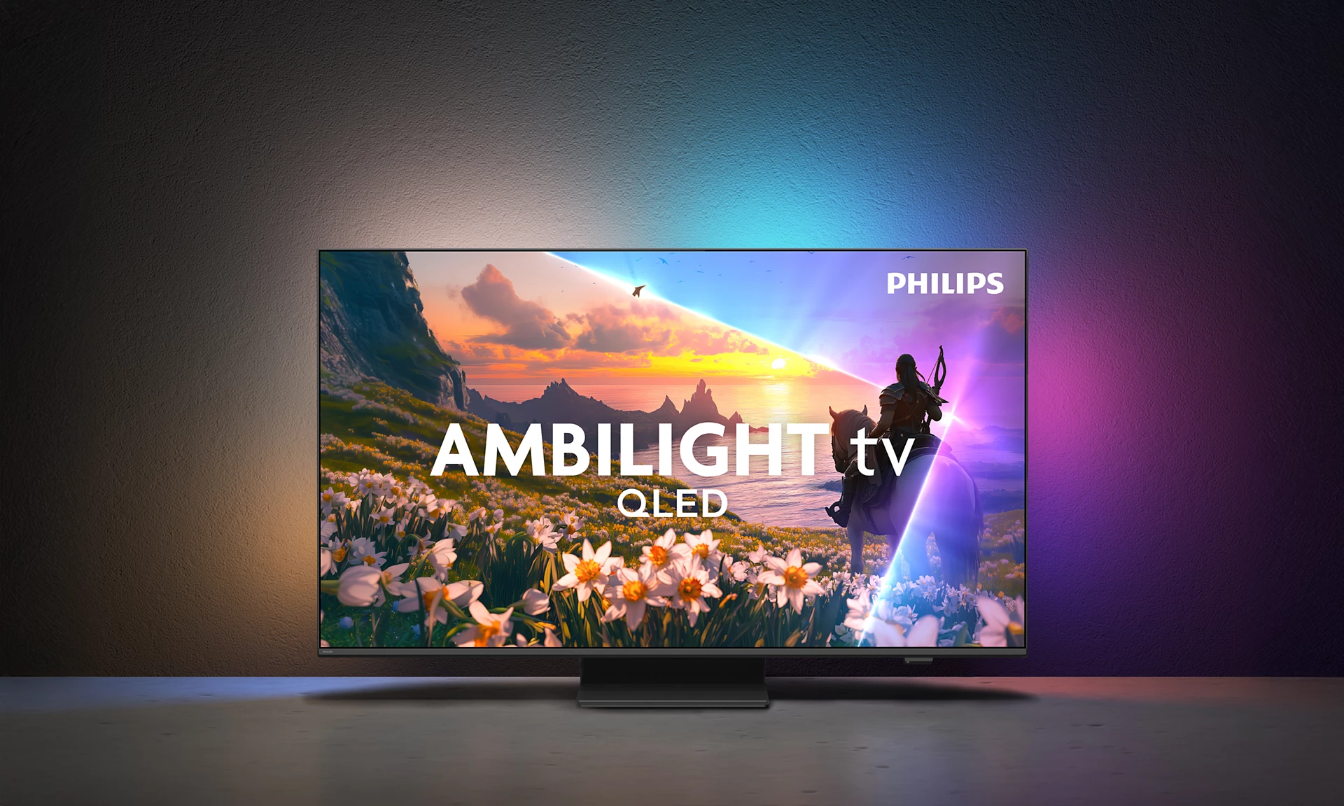 Philips Ambilight TV mit QLED-Display zeigt eine epische Landschaft mit Reiter.