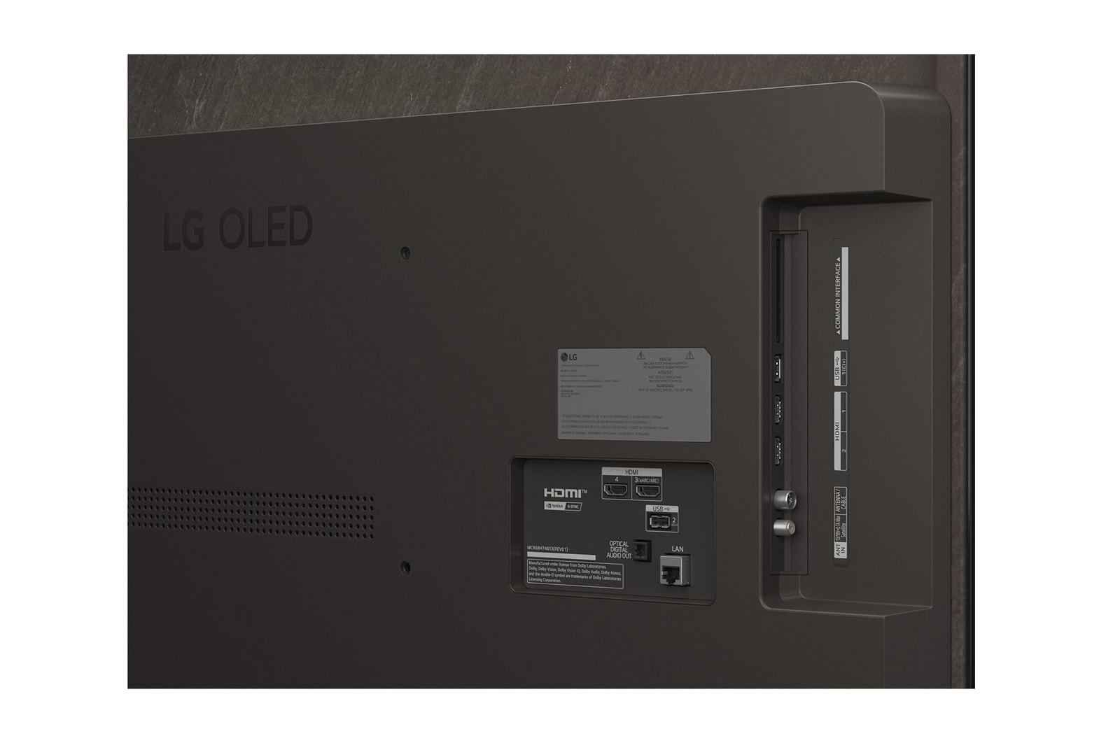 Tył czarnego telewizora LG OLED z portami HDMI i USB.