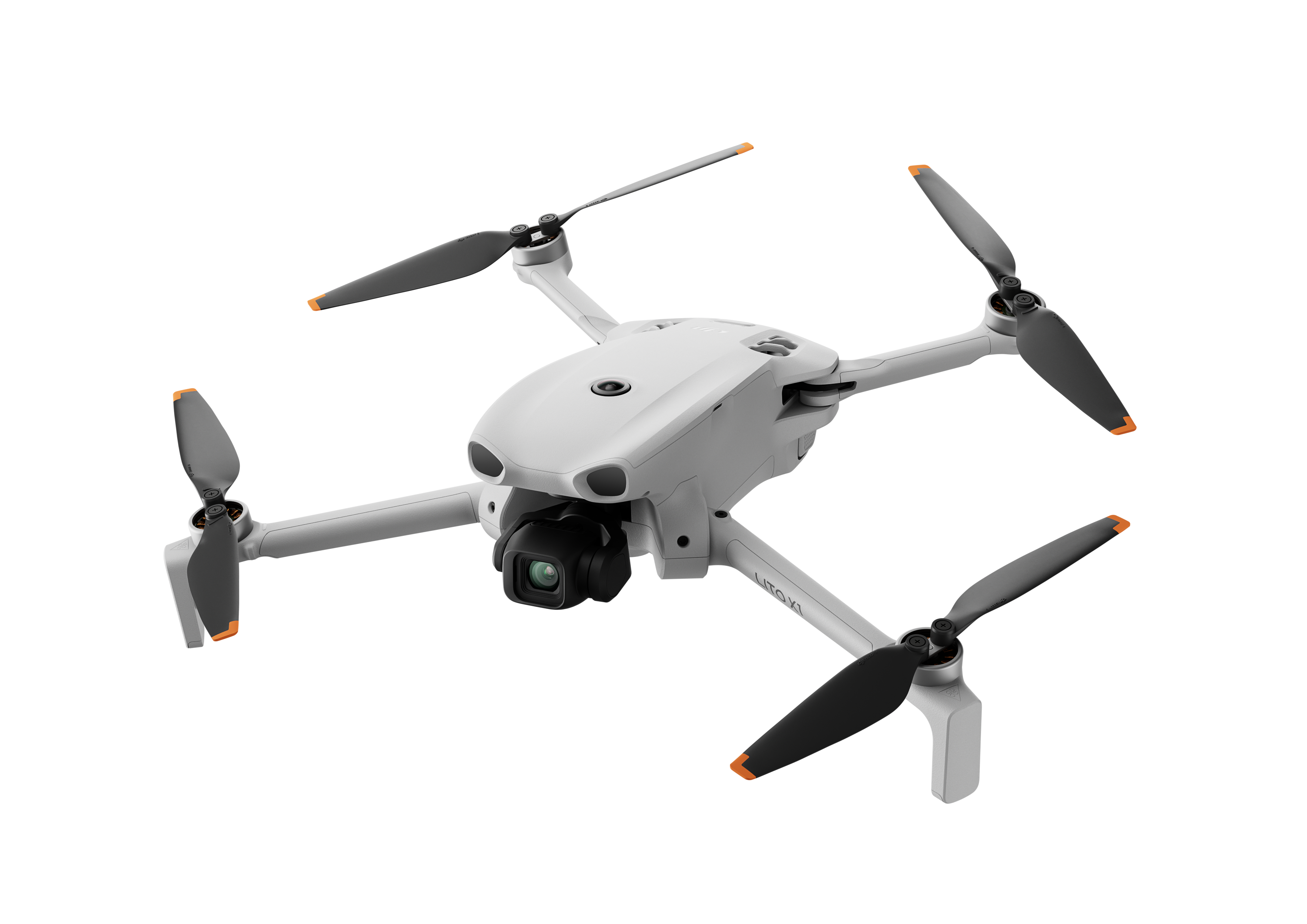 Biały dron quadrocopter z czarnymi śmigłami i pomarańczowymi końcówkami na czarnym tle.