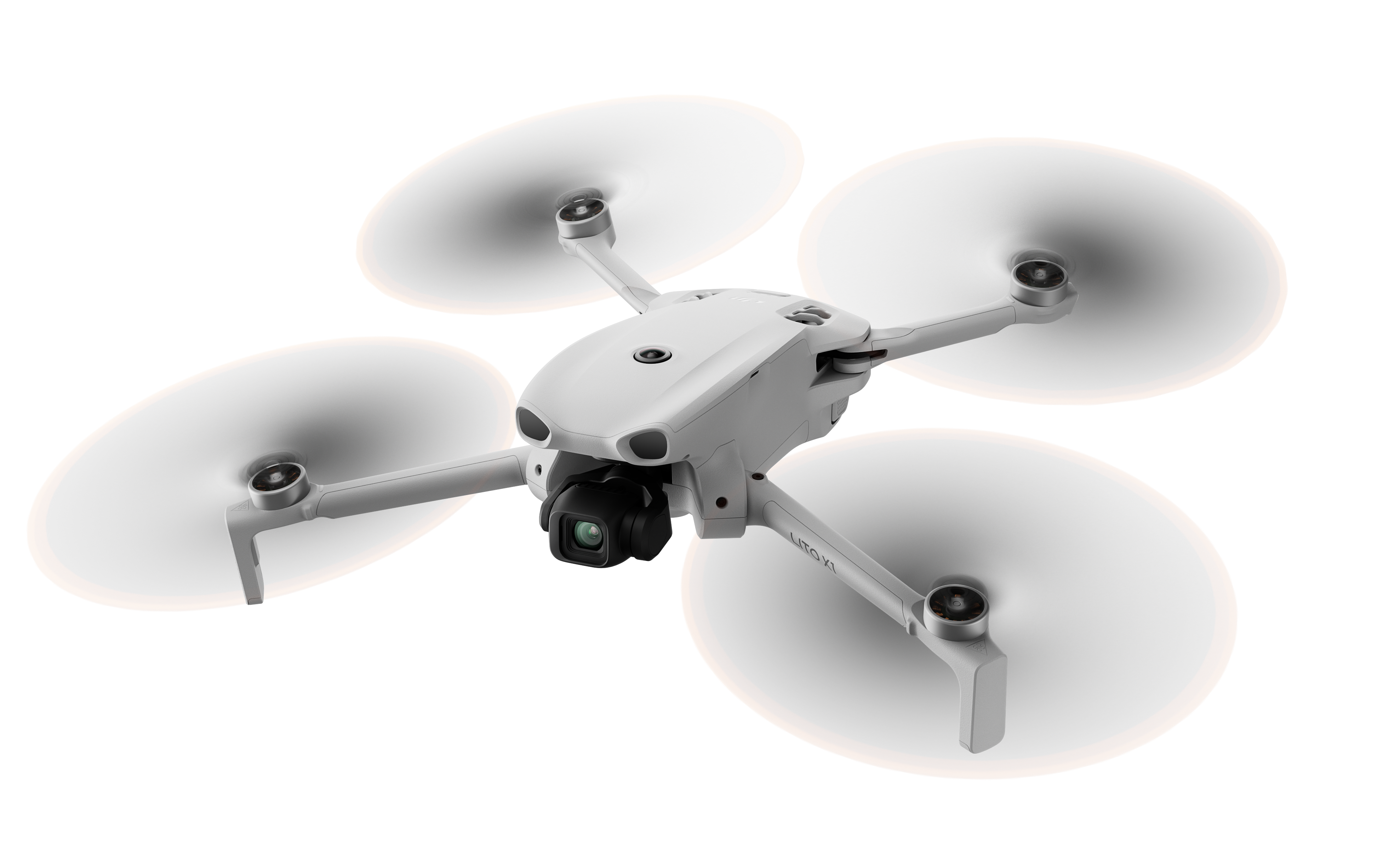 Biały dron czterowirnikowy unosi się z obracającymi się śmigłami na białym tle.