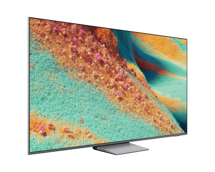 Nowoczesny telewizor z płaskim ekranem wyświetlający abstrakcyjne, kolorowe tło. Stoi na srebrnej podstawie.