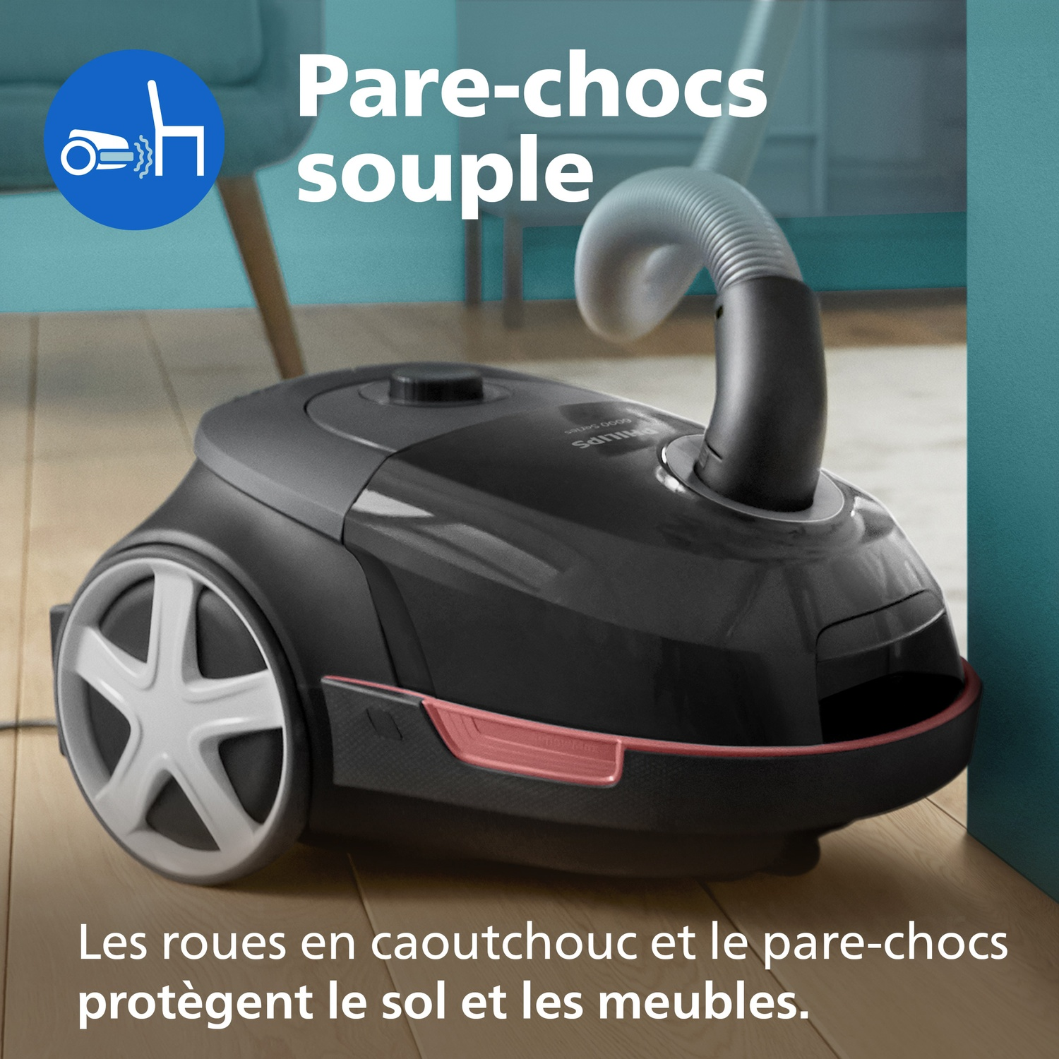 Aspirateur noir avec roues en caoutchouc et pare-chocs, protège les meubles.