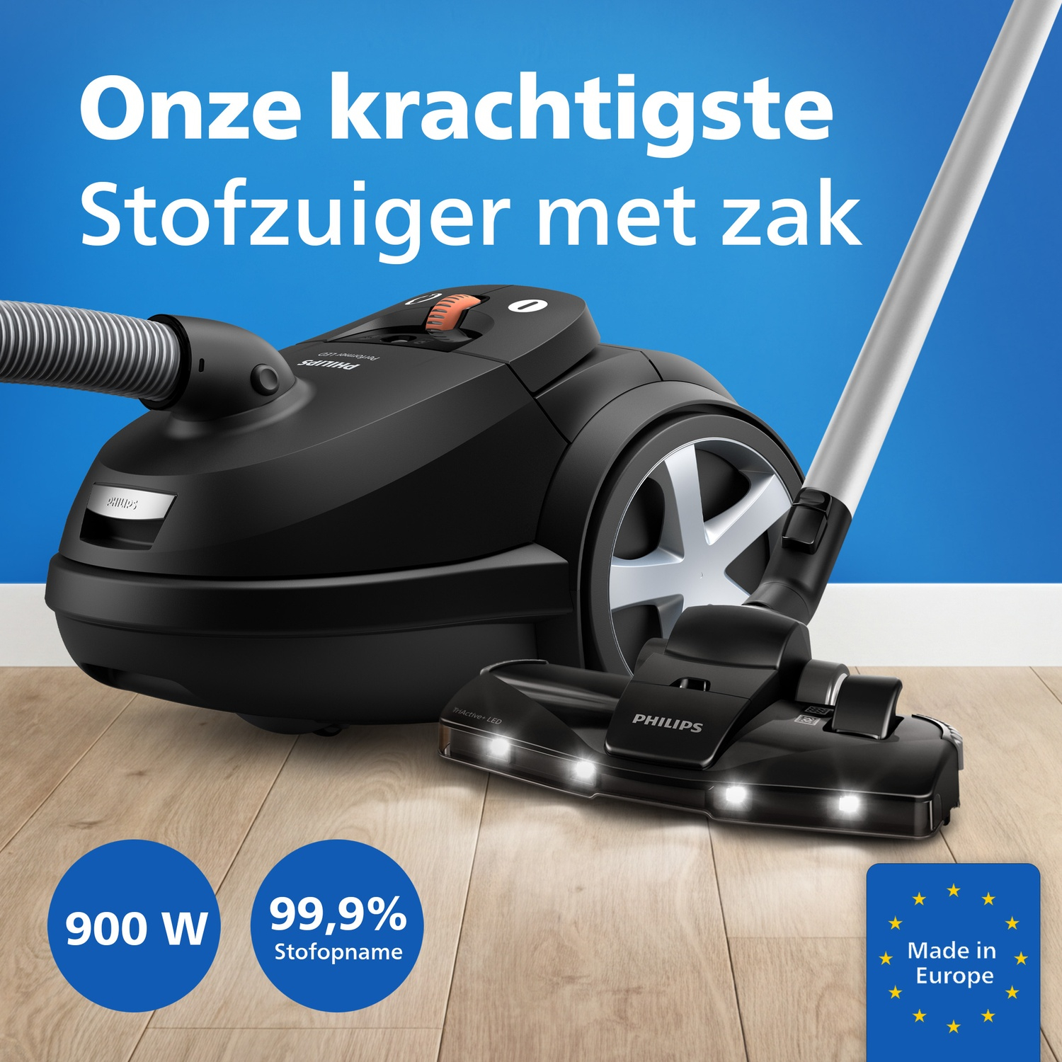 Black Philips vacuum cleaner on wooden floor, with text and icons.
