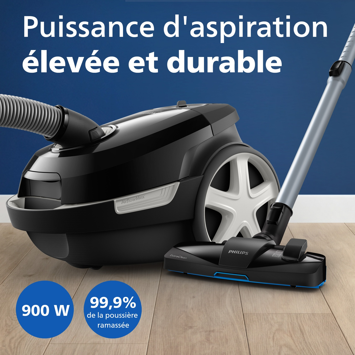 Aspirateur Philips noir à forte puissance d'aspiration sur parquet.