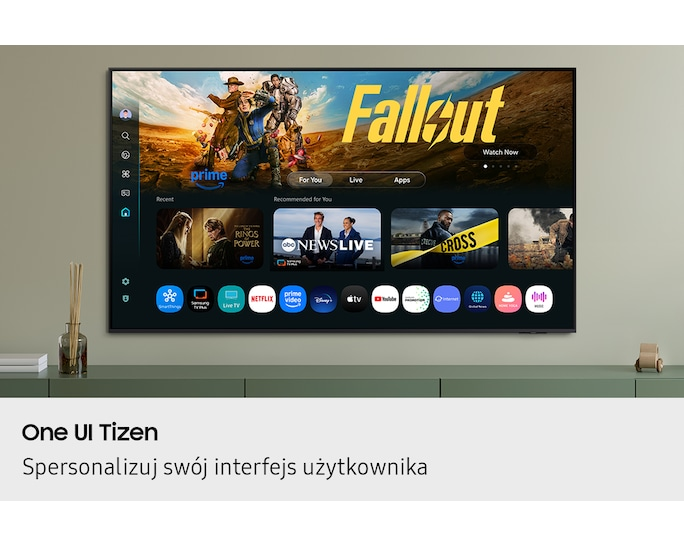 Telewizor Samsung wyświetla interfejs One UI Tizen z aplikacjami takimi jak Fallout, Prime Video, Netflix.