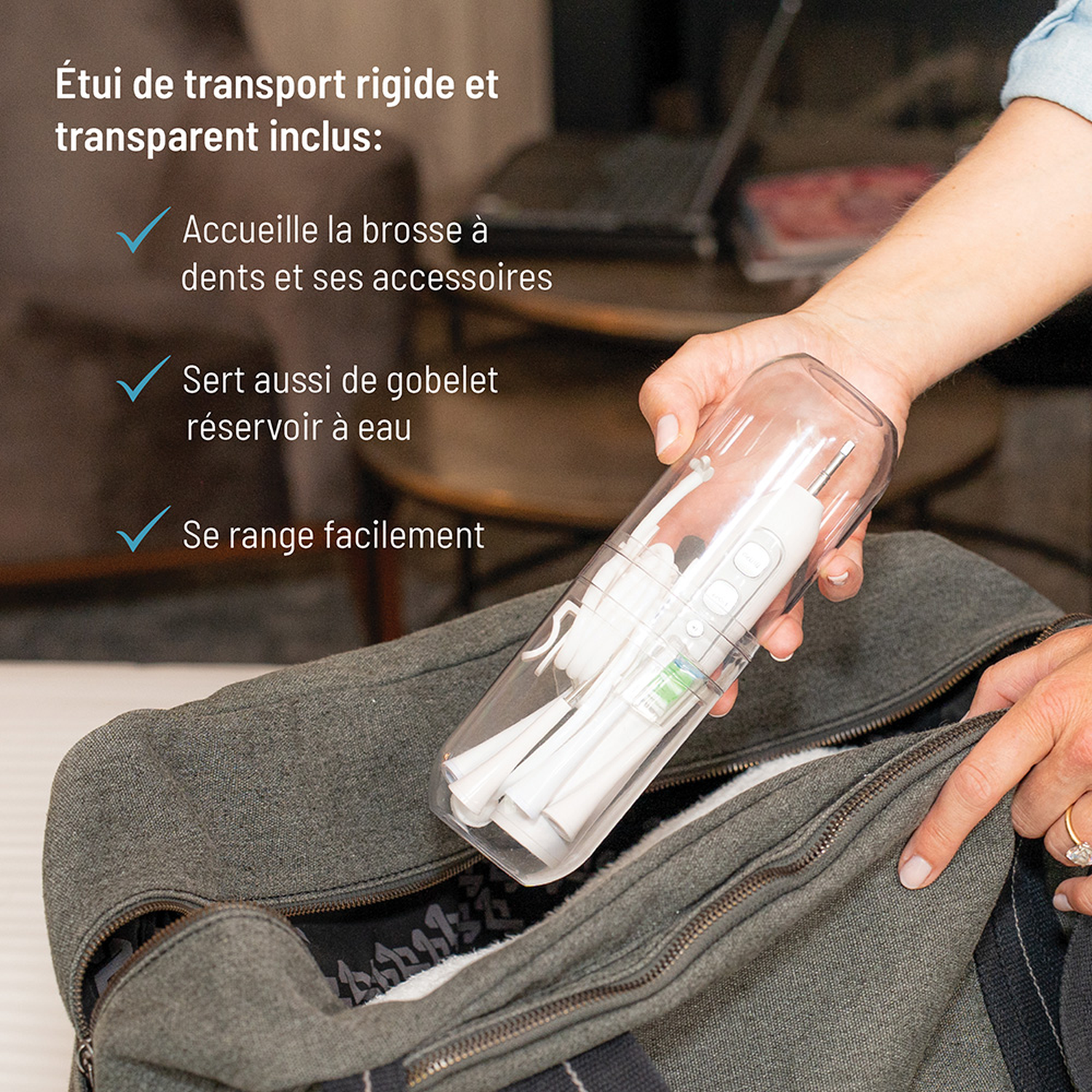 Person places travel case with electric toothbrush into bag.