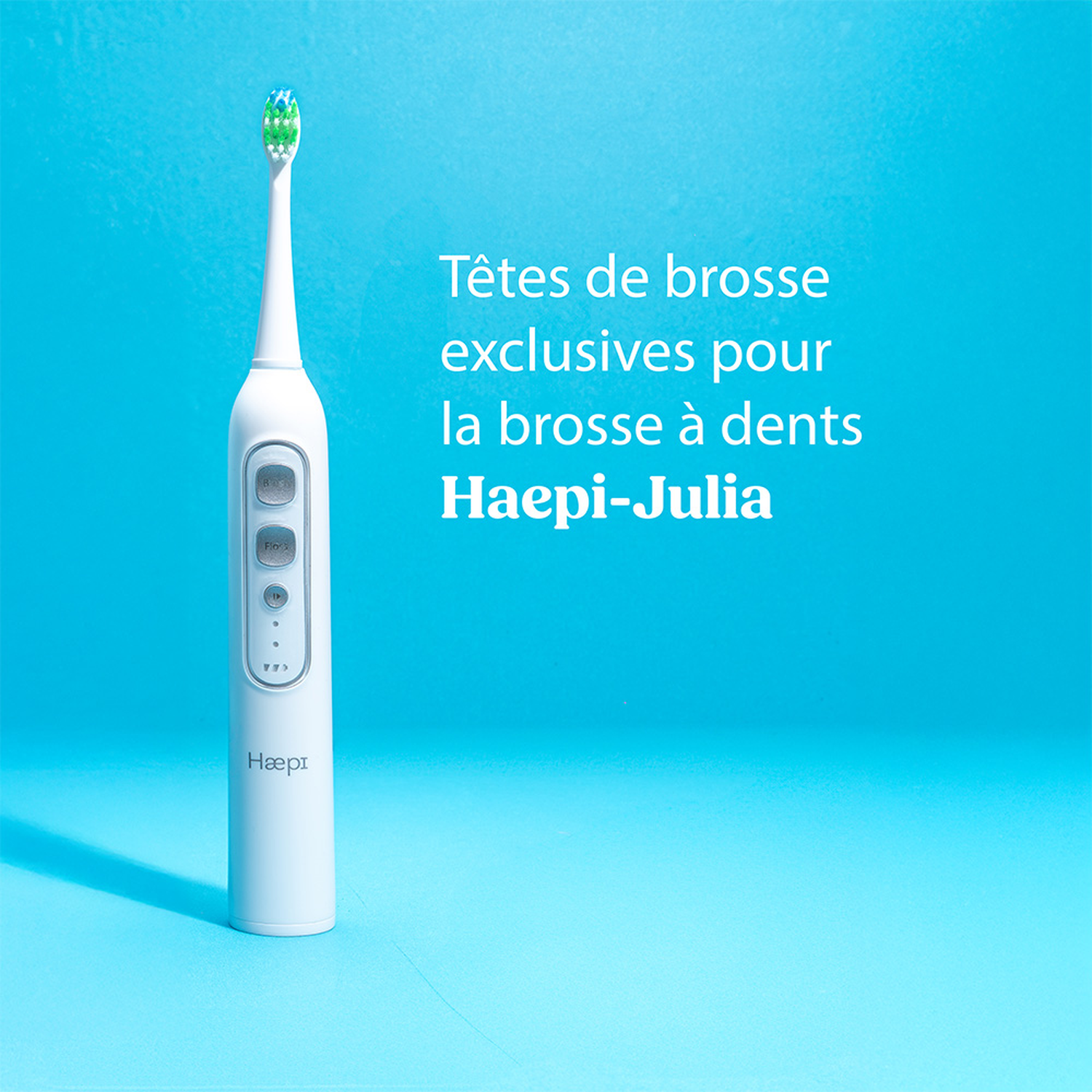 A white electric toothbrush with a blue-green brush head on a blue background.
