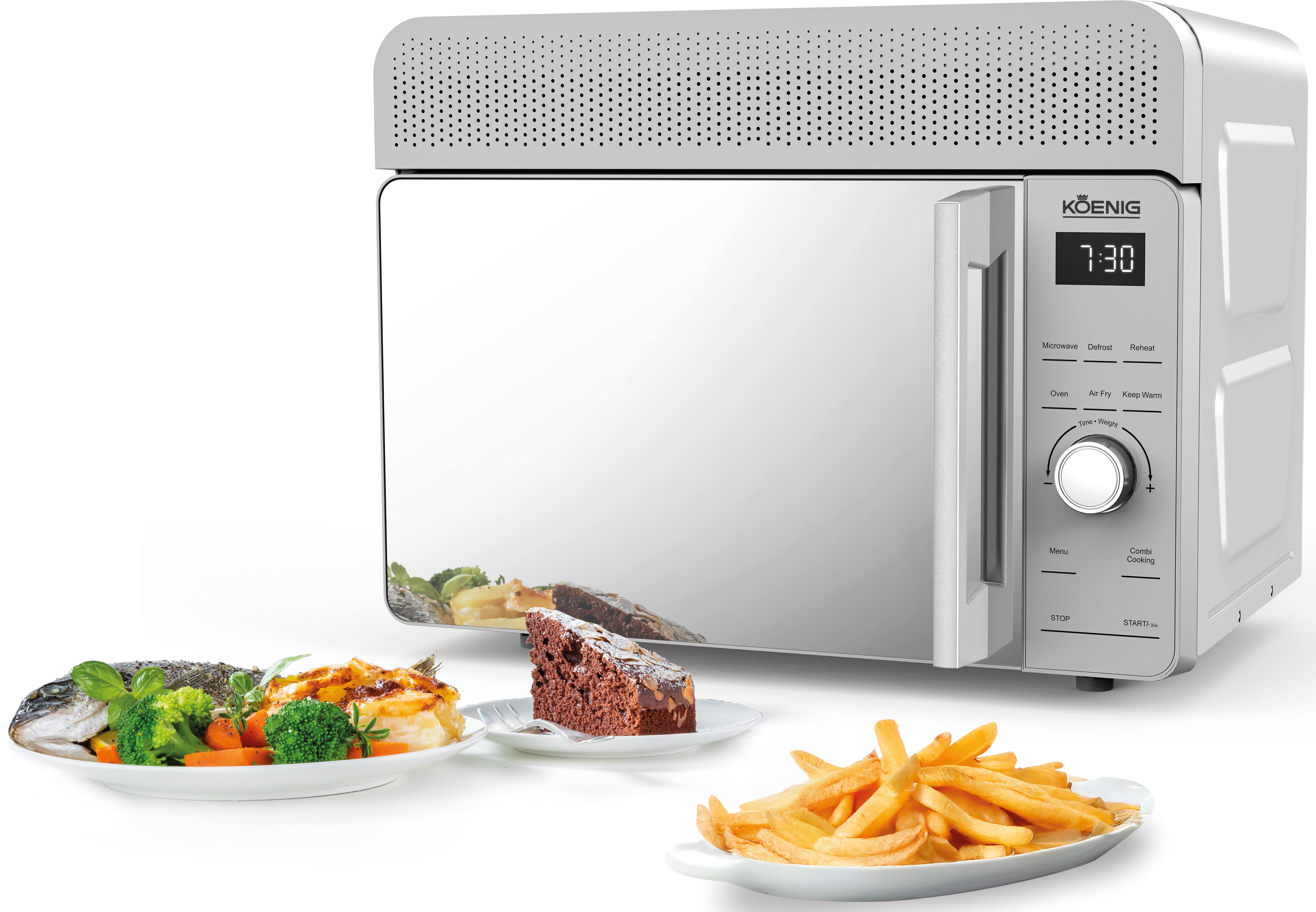 Un micro-ondes blanc KOENIG avec un écran numérique 7:30, à côté de trois assiettes de nourriture.