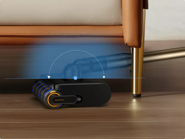 Bodenreiniger-Kopf mit Bürste unter einem braunen und cremefarbenen Sofa.