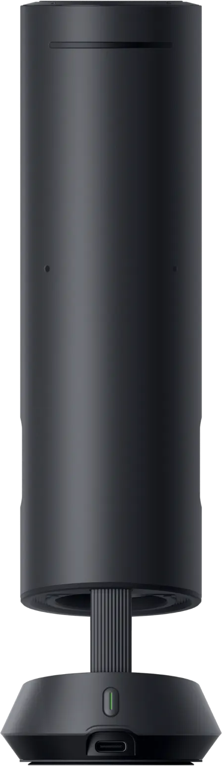 Une enceinte cylindrique noire avec un pied côtelé et un port USB-C.