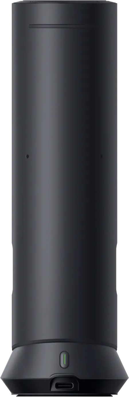 Haut-parleur cylindrique noir avec port USB-C et indicateur LED vert.