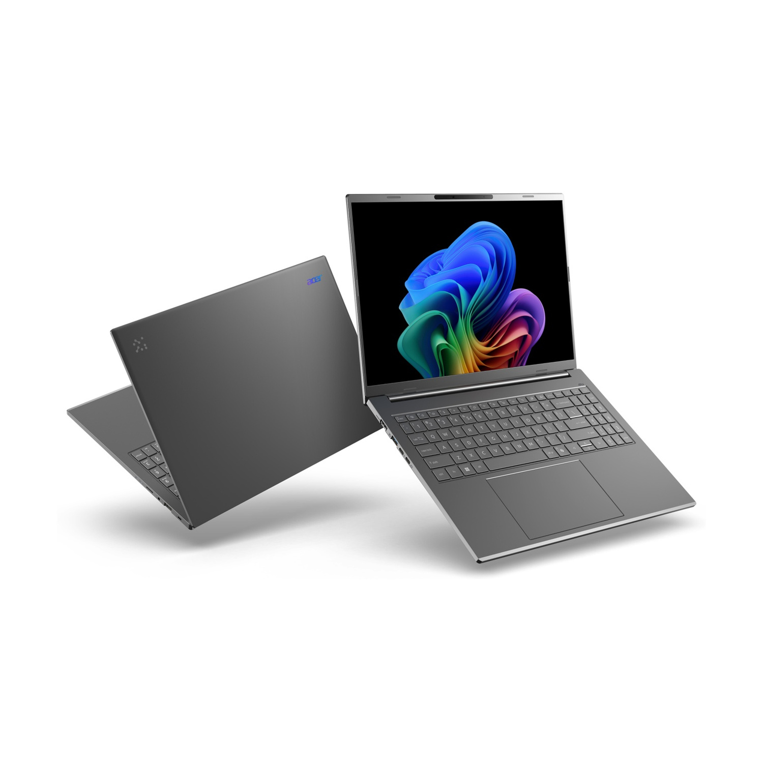 Due laptop grigi su sfondo bianco, uno aperto mostra uno sfondo astratto colorato.