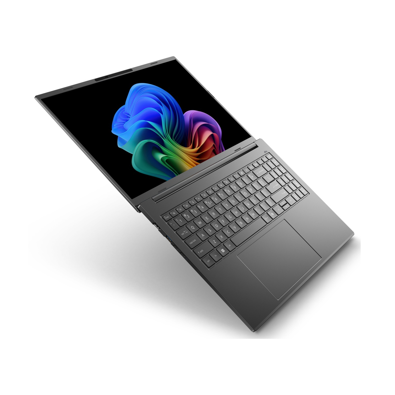Un laptop grigio con schermo aperto, che mostra un'immagine astratta colorata.