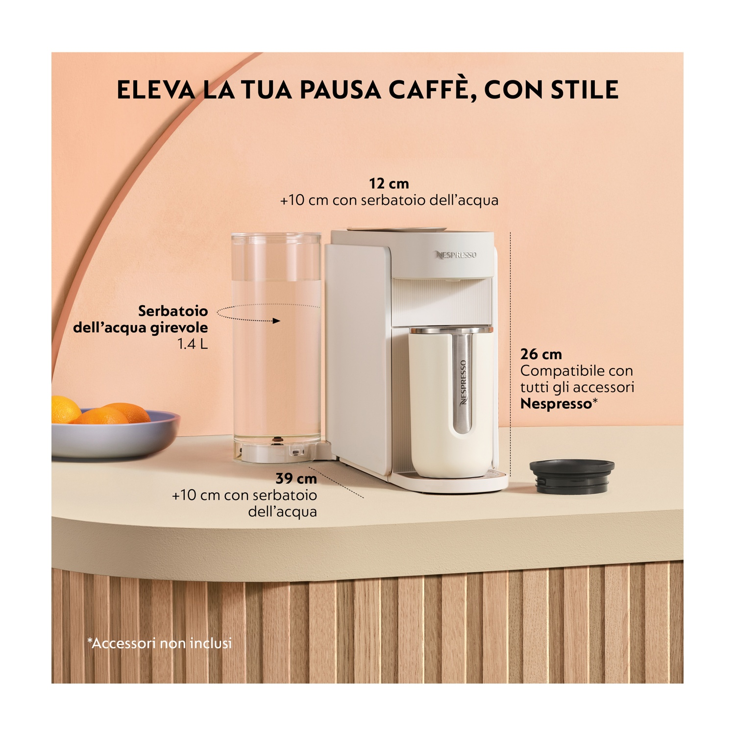 Macchina da caffè bianca con bicchiere, arance e testo su tavolo.