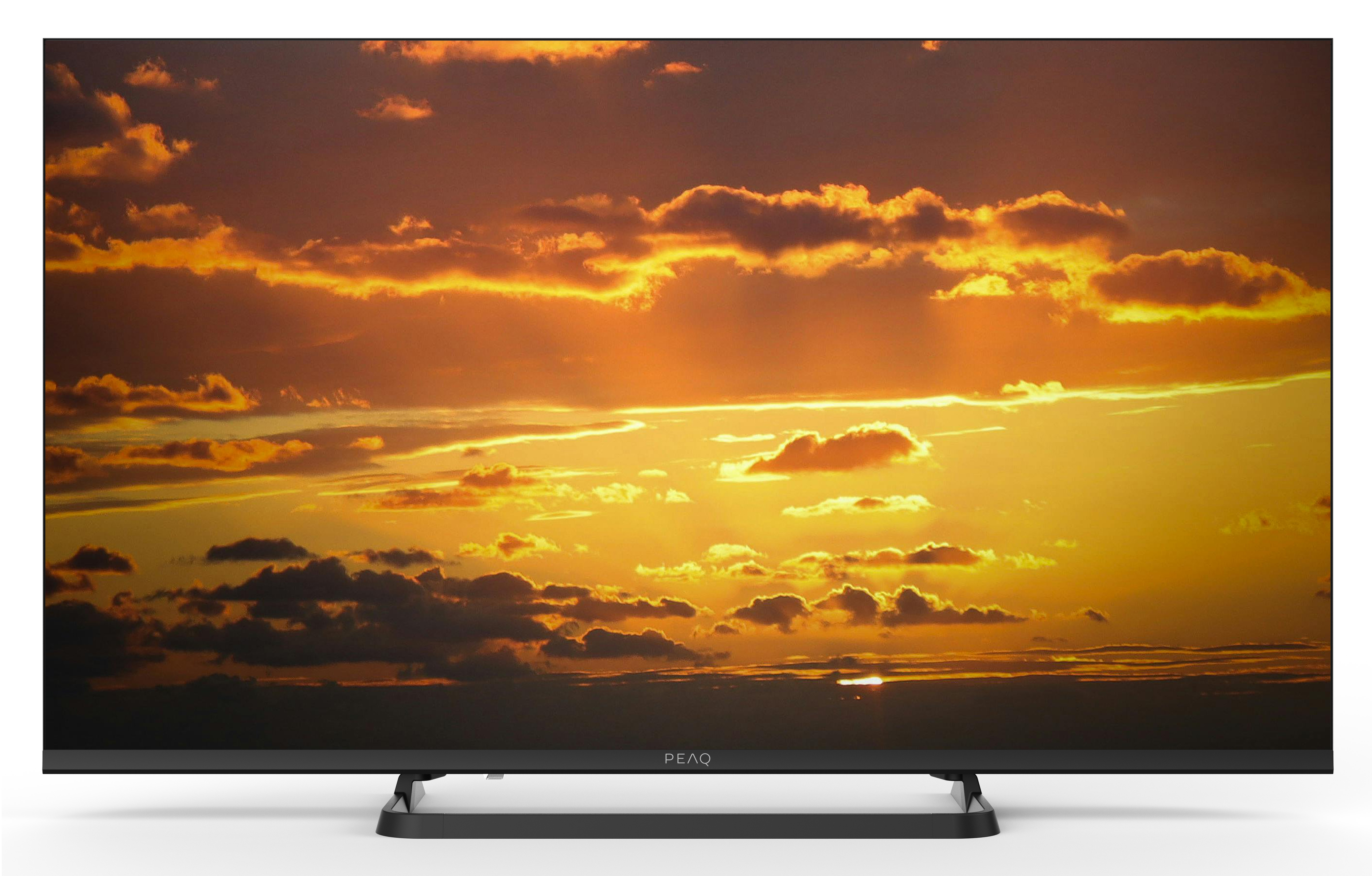 Telewizor wyświetla dramatyczny zachód słońca z pomarańczowymi chmurami.