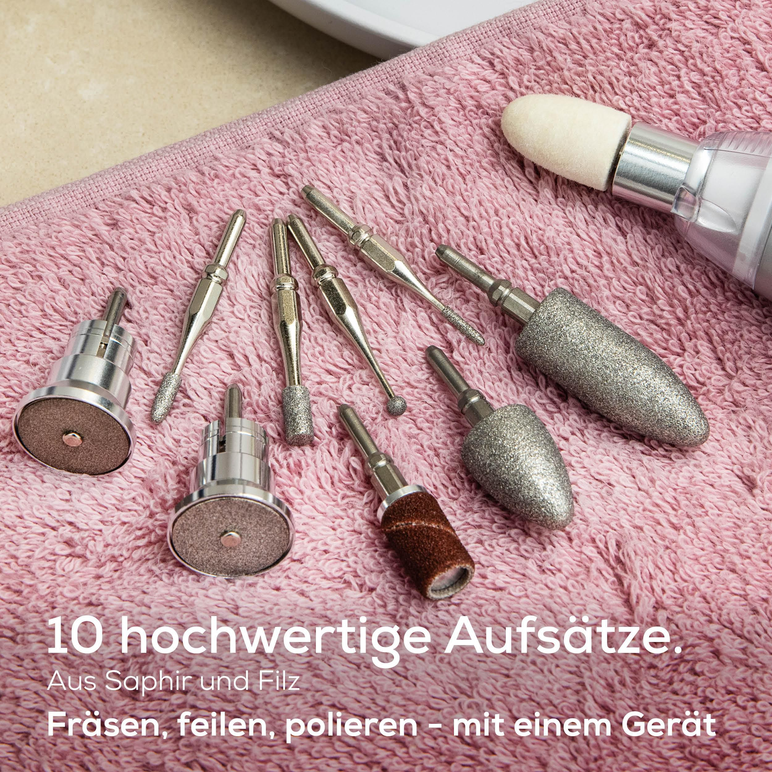 Zehn hochwertige Nagelpflege-Aufsätze auf einem rosa Handtuch.
