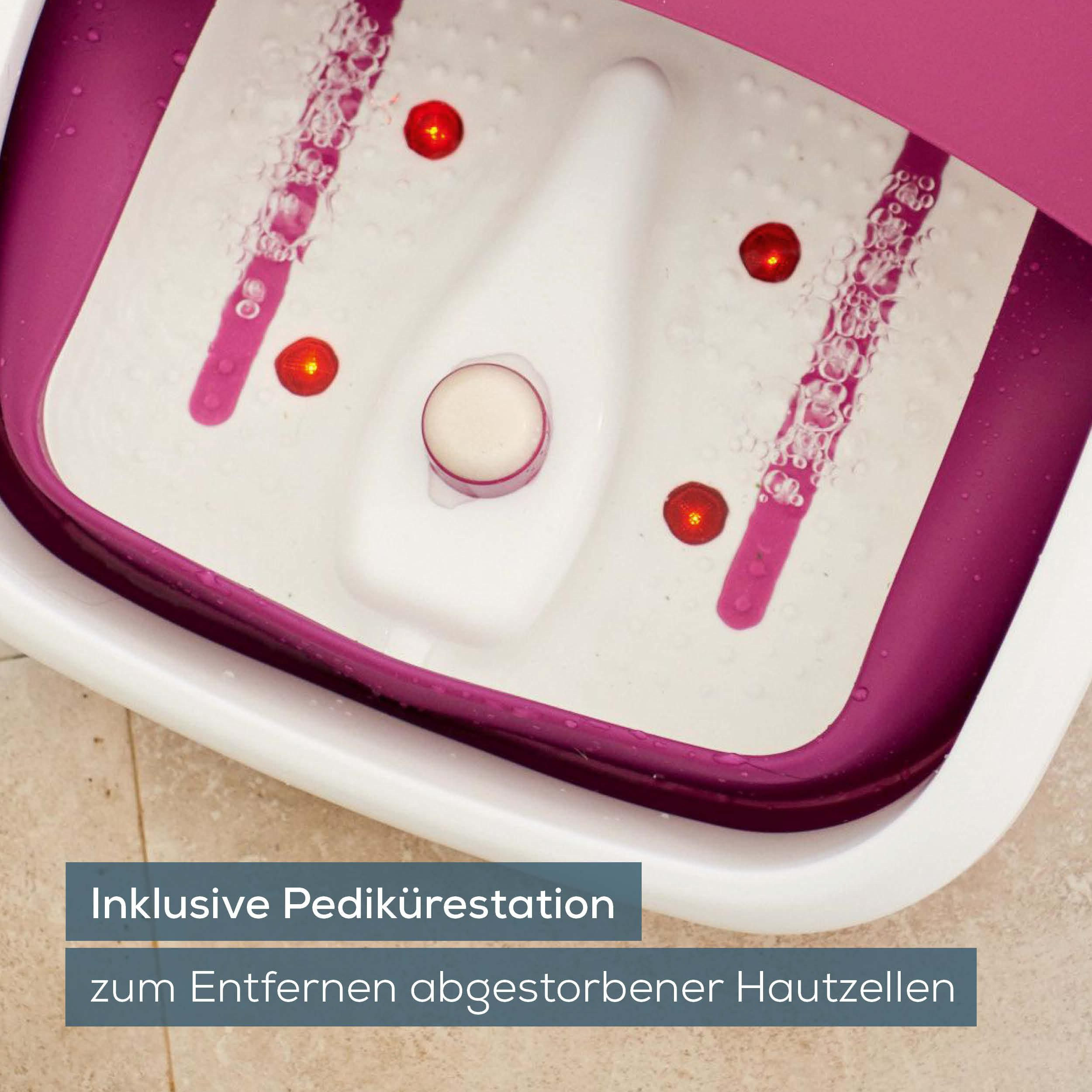 Ein aufklappbares Fußbad mit rosa Rand, Wasserblasen und roten Lichtern.