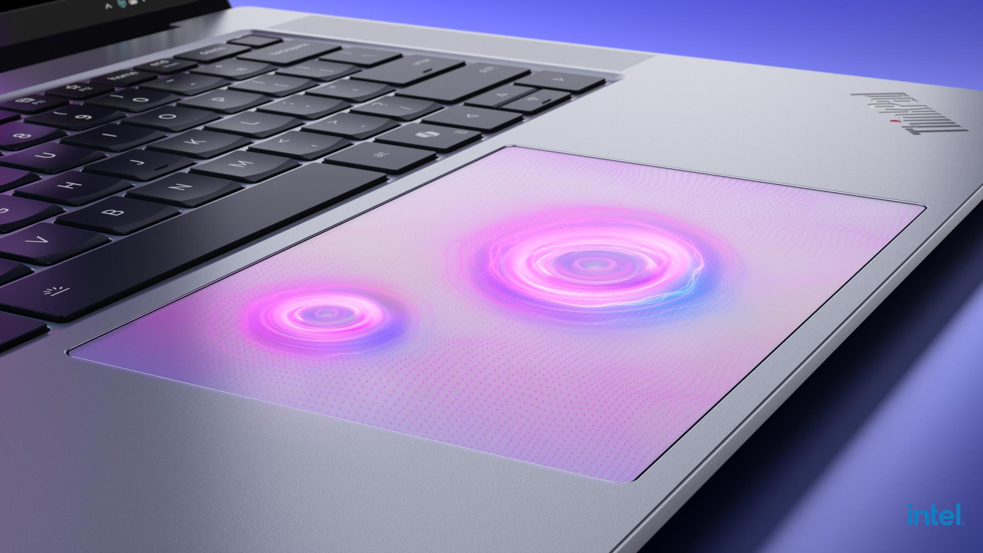 Laptop-Tastatur mit beleuchtetem Touchpad mit Wirbelmustern.